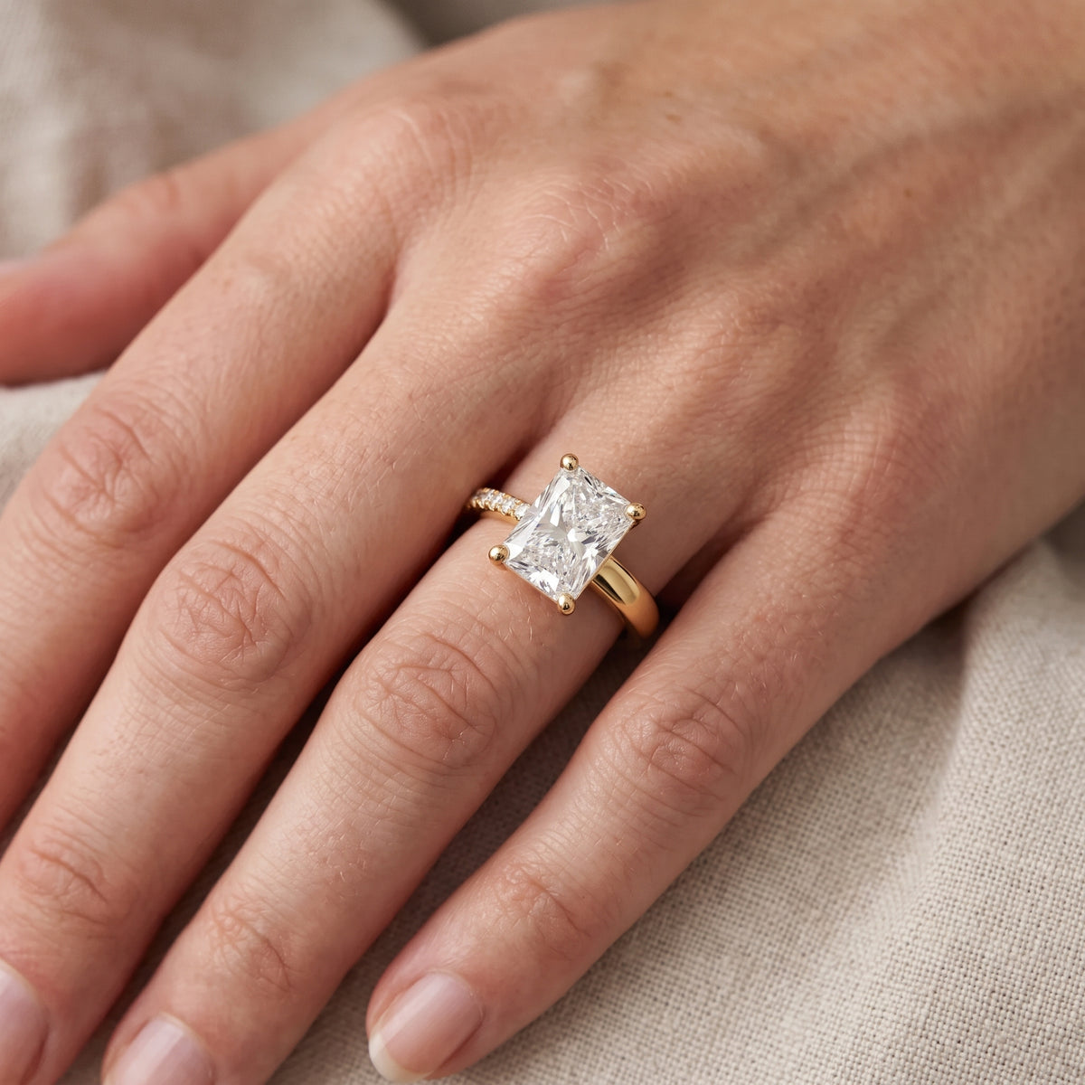 Rosie Solitaire Basket Radiant Diamond Engagement Ring in Yellow Gold - lifestyle.jpg