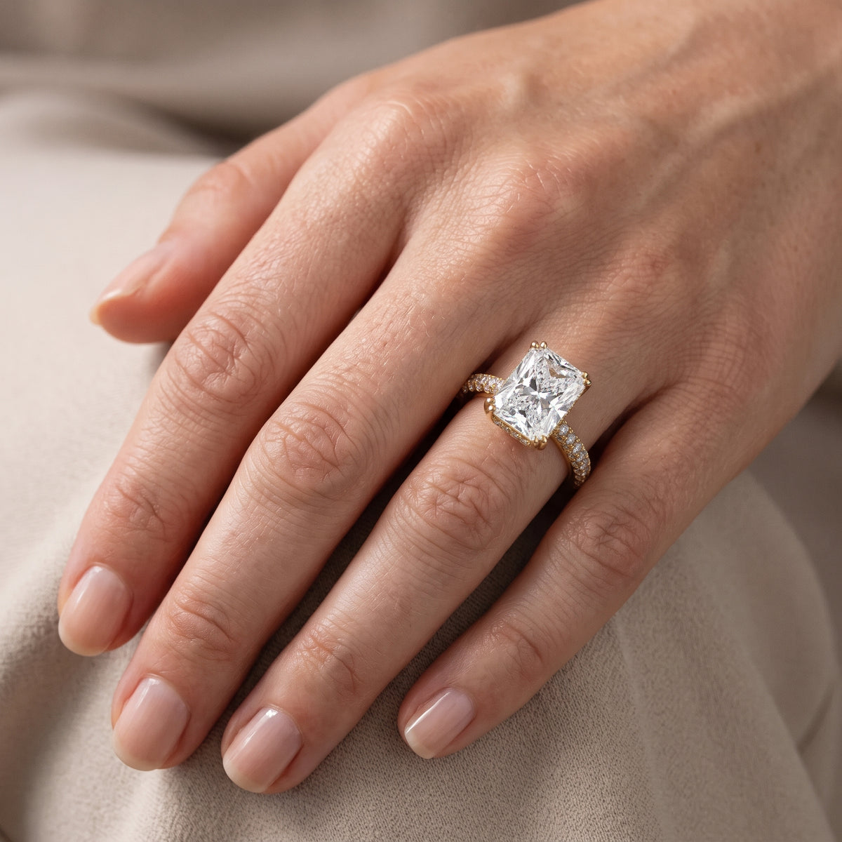 Celeste Hidden Halo Pavé Radiant Diamond Engagement Ring in Yellow Gold - lifestyle.jpg