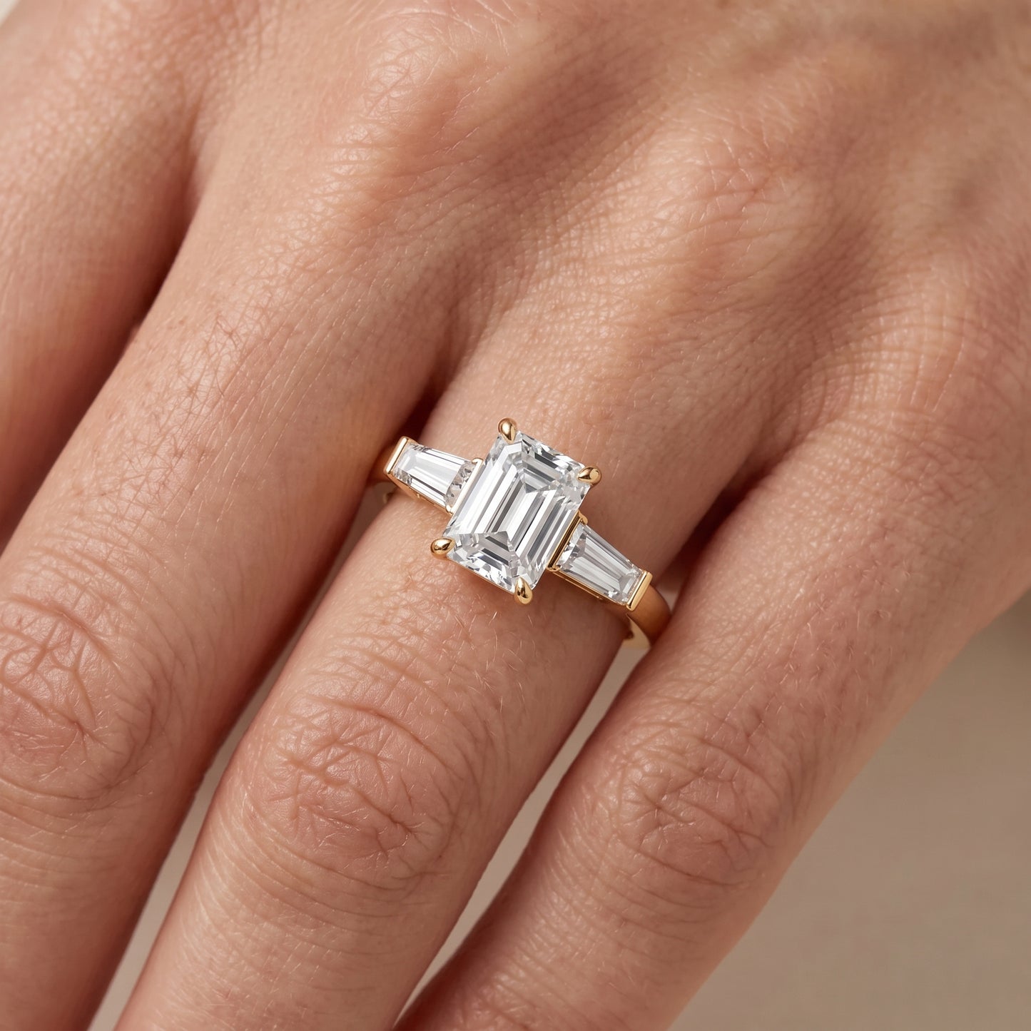 Zelda Tapered Baguette Emerald Diamond Engagement Ring in Yellow Gold - lifestyle.jpg