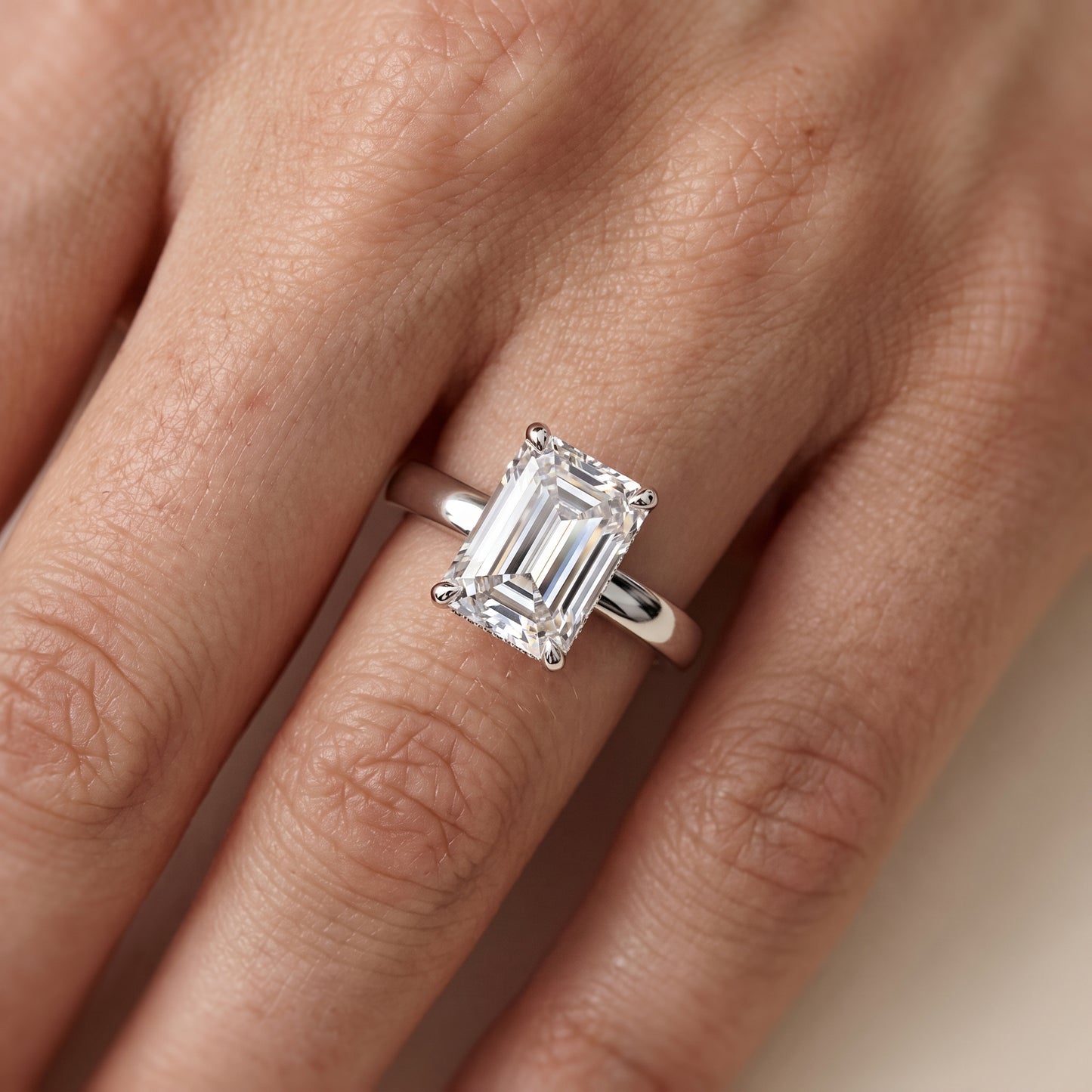Lara Hidden Halo Emerald Diamond Engagement Ring in Silver - lifestyle.jpg