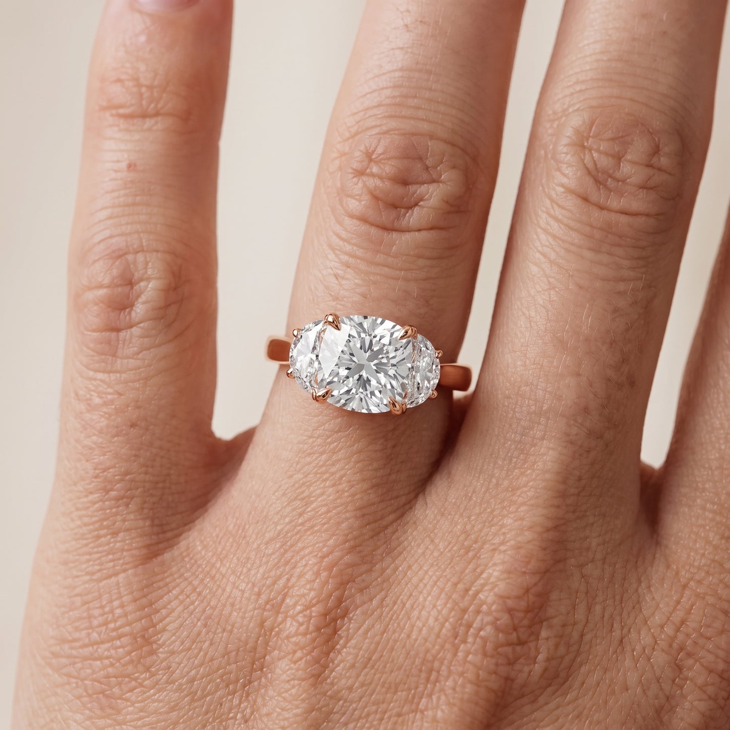 Romy Three-Stone Cushion Diamond Engagement Ring in Rose Gold - lifestyle.jpg