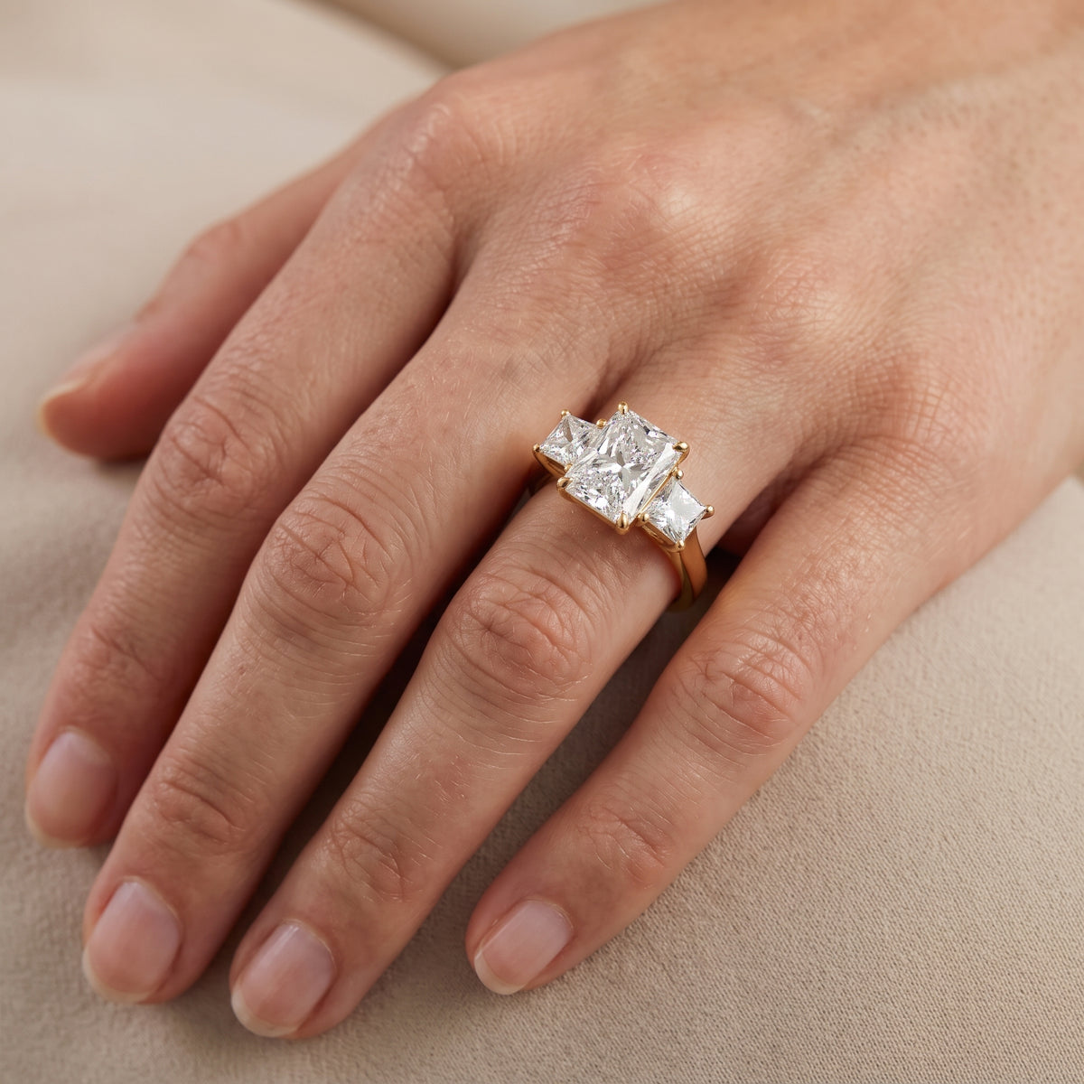 Sienna Three-Stone Radiant Diamond Engagement Ring in Yellow Gold - lifestyle.jpg