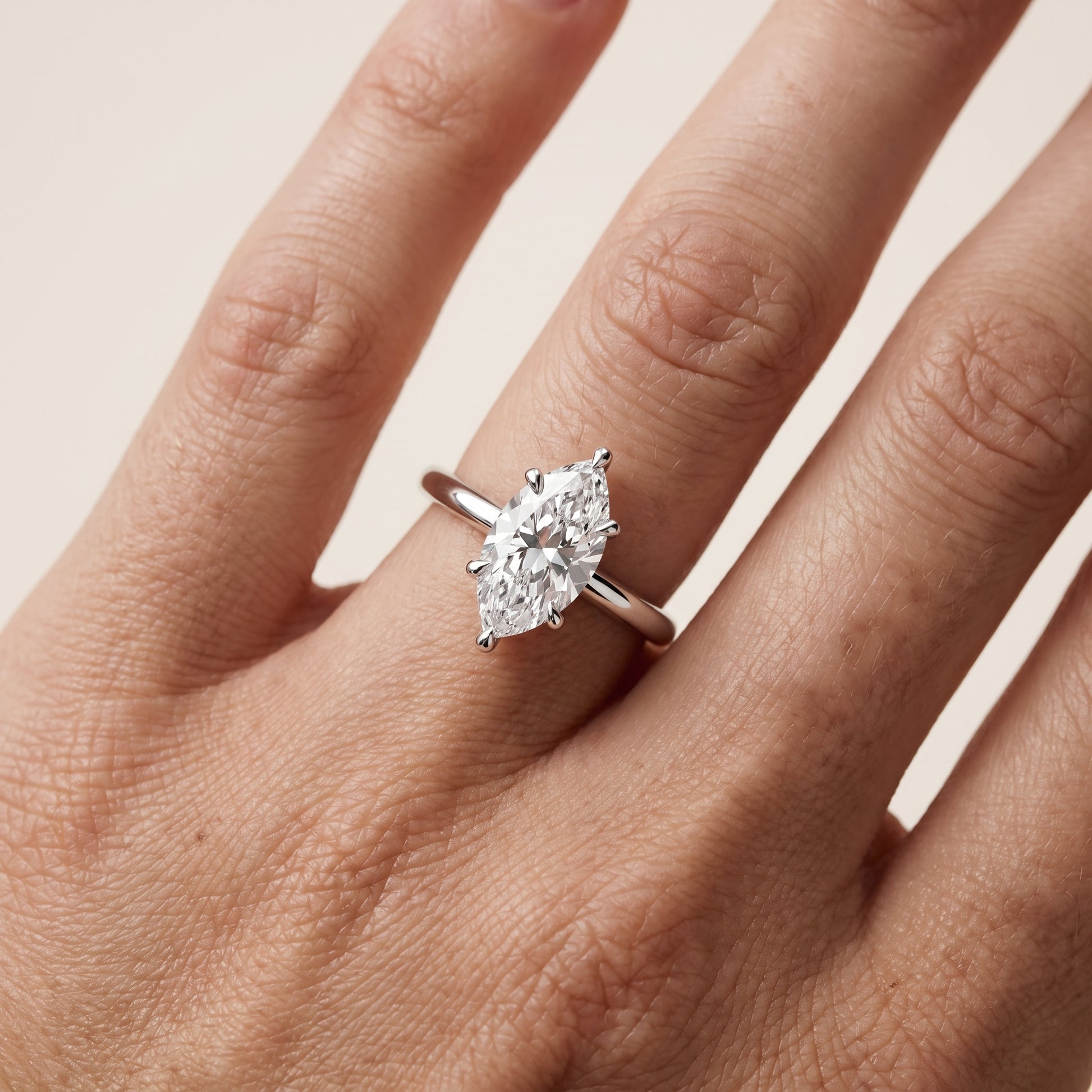 Nella Petite Solitaire Marquise Diamond Engagement Ring in Platinum - lifestyle.jpg