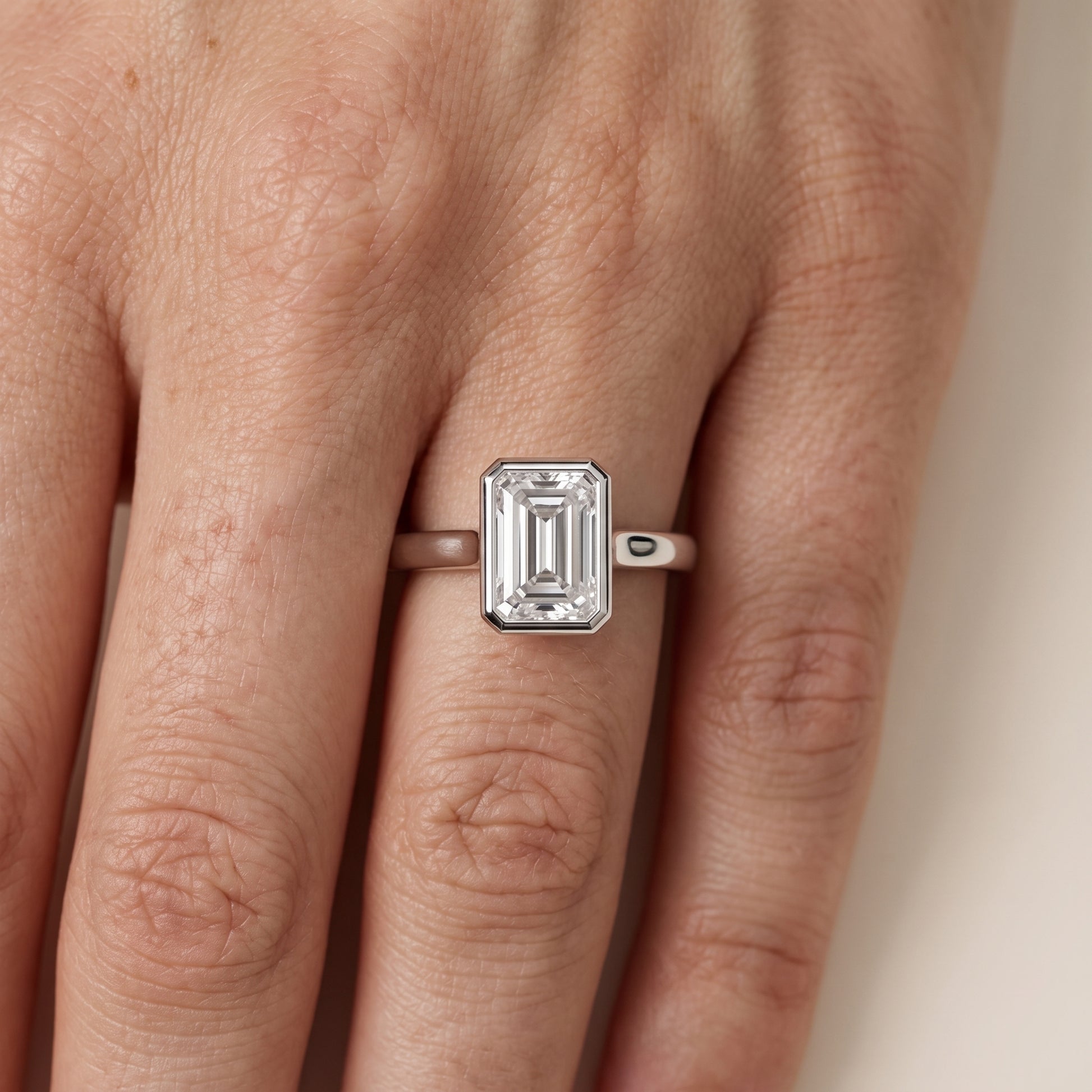 Jolie Bezel Solitaire Emerald Diamond Engagement Ring in White Gold - lifestyle.jpg