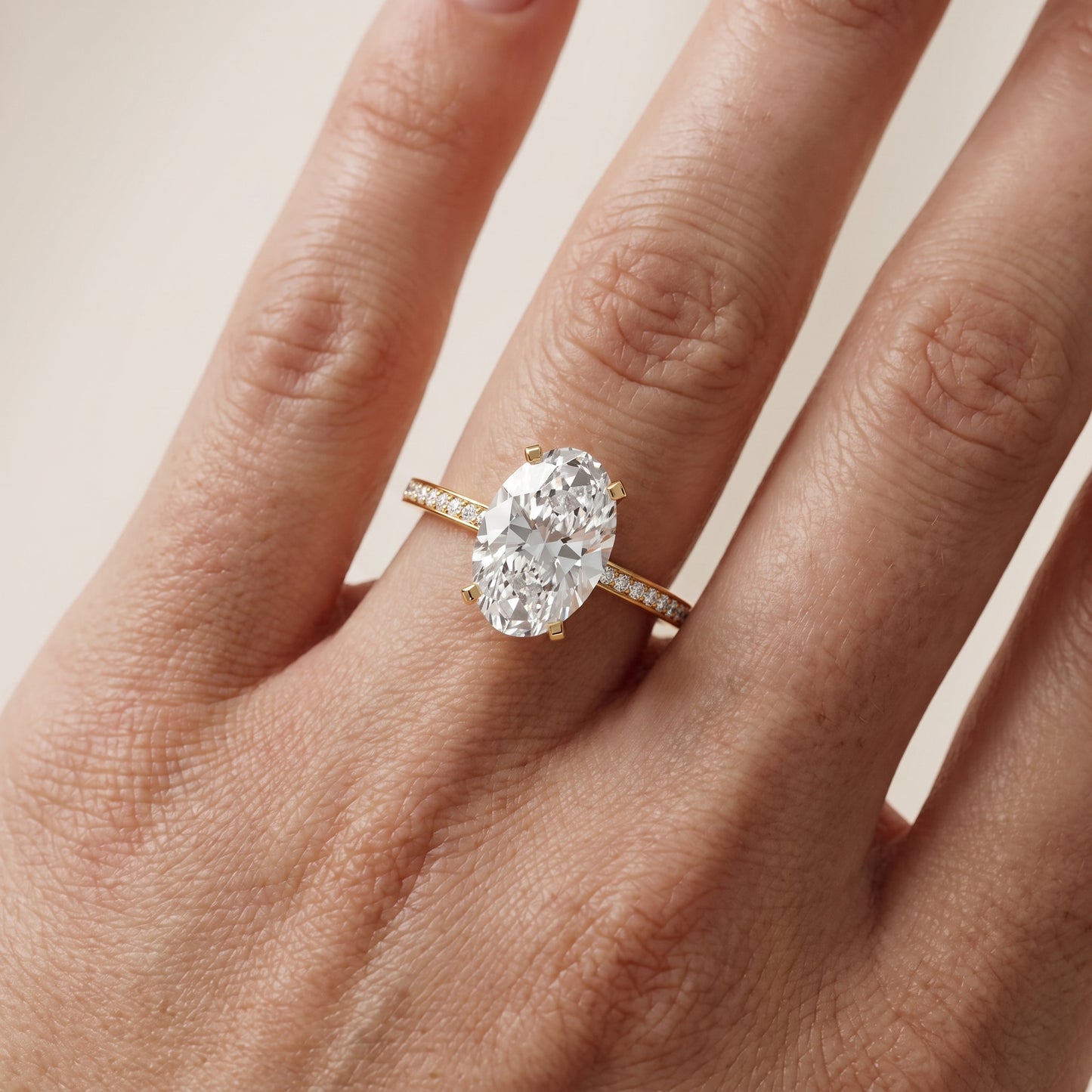 Naia Hidden Halo Oval Diamond Ring in Yellow Gold - lifestyle.jpg