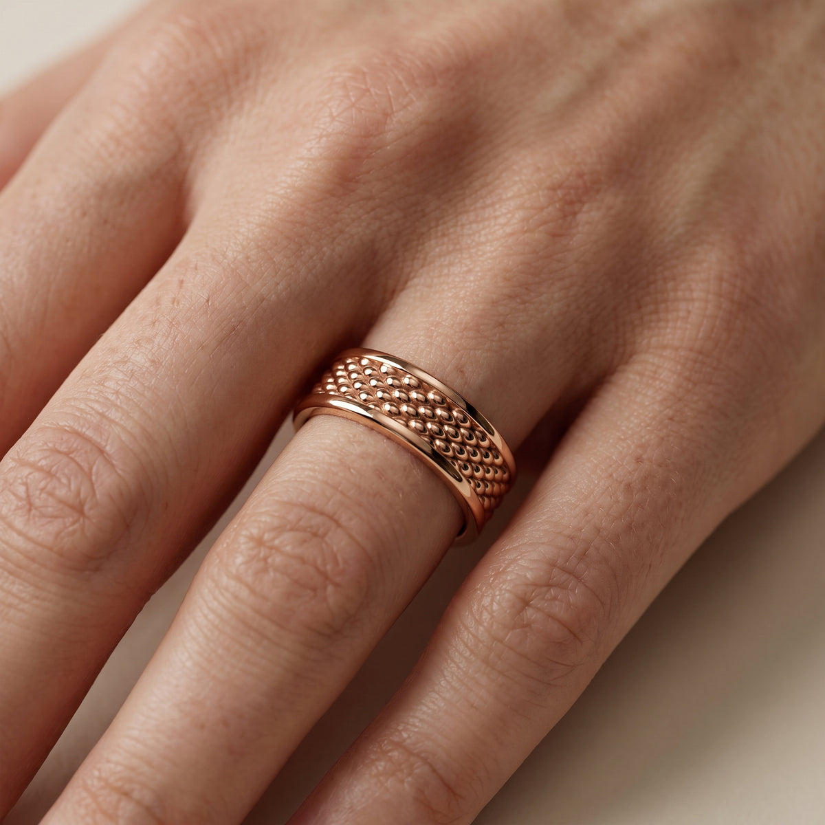 Cordelia Carved Step Edge Wedding Band in Rose Gold - lifestyle.jpg