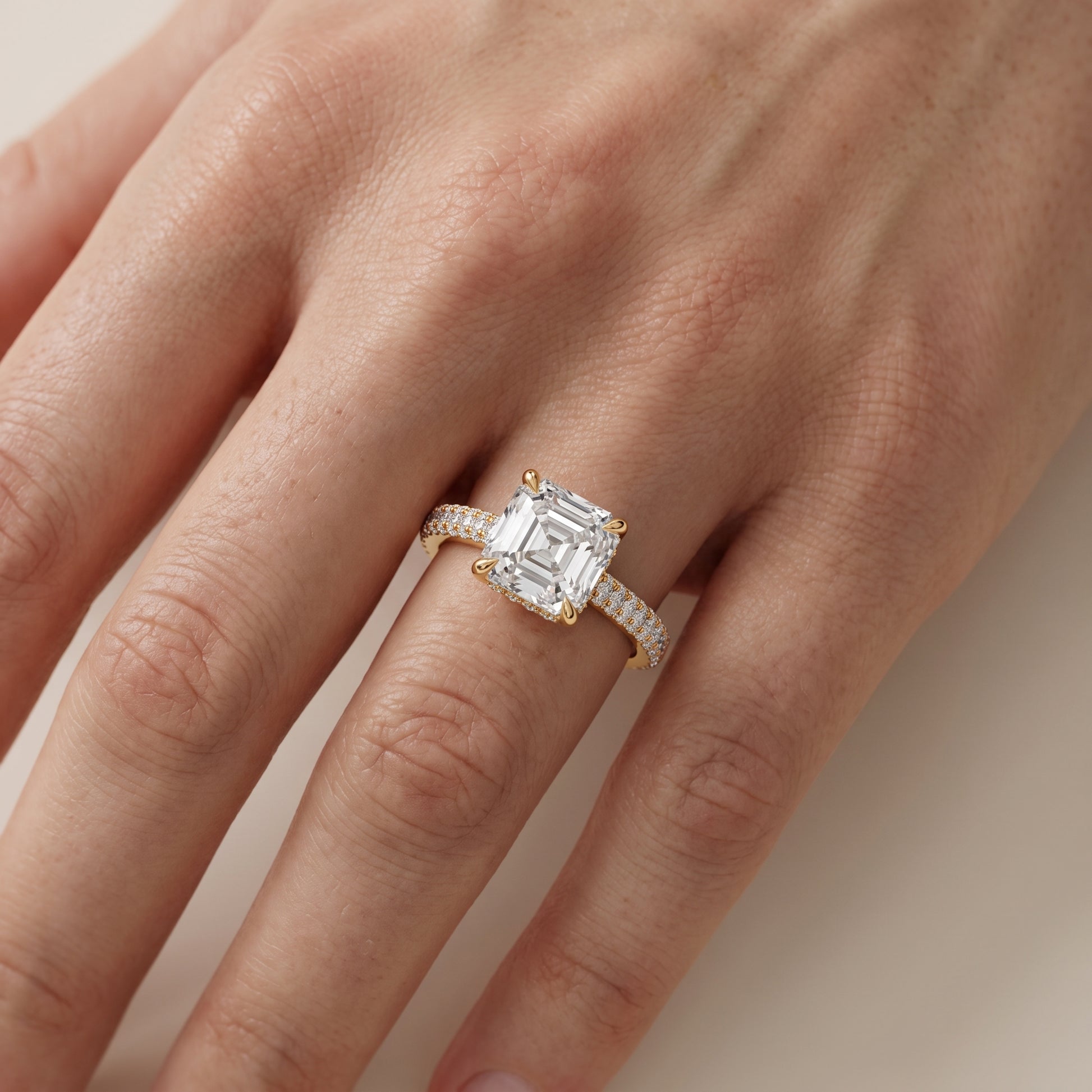 Della Hidden Halo Pavé Asscher Diamond Engagement Ring in Yellow Gold - lifestyle.jpg