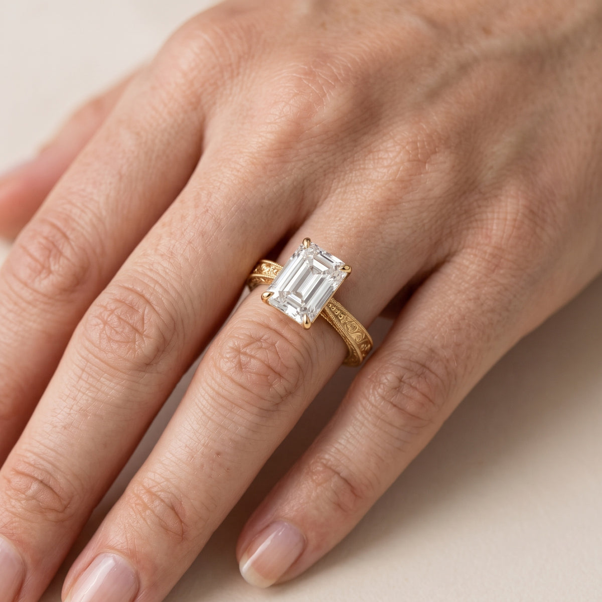 Kailua Vintage Engraved Emerald Diamond Engagement Ring in Yellow Gold - lifestyle.jpg