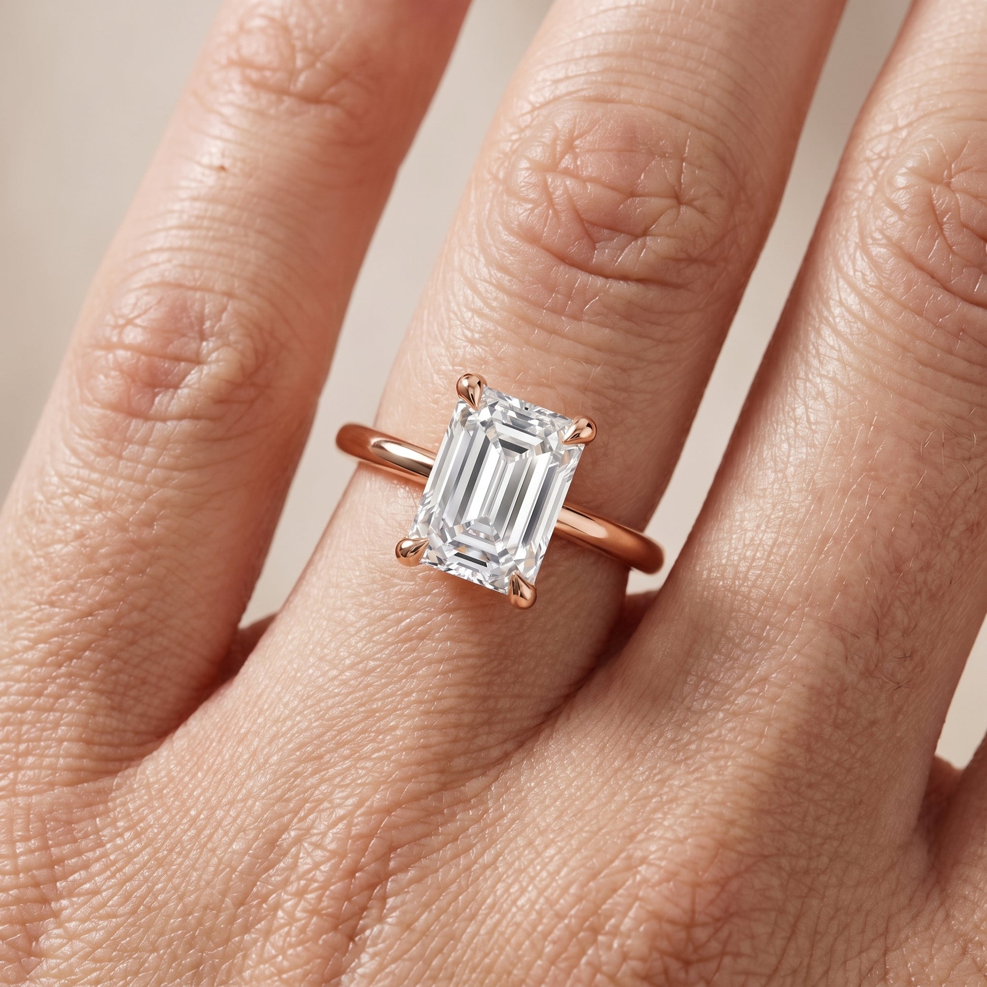 Nella Petite Solitaire Emerald Diamond Engagement Ring in Rose Gold - lifestyle.jpg