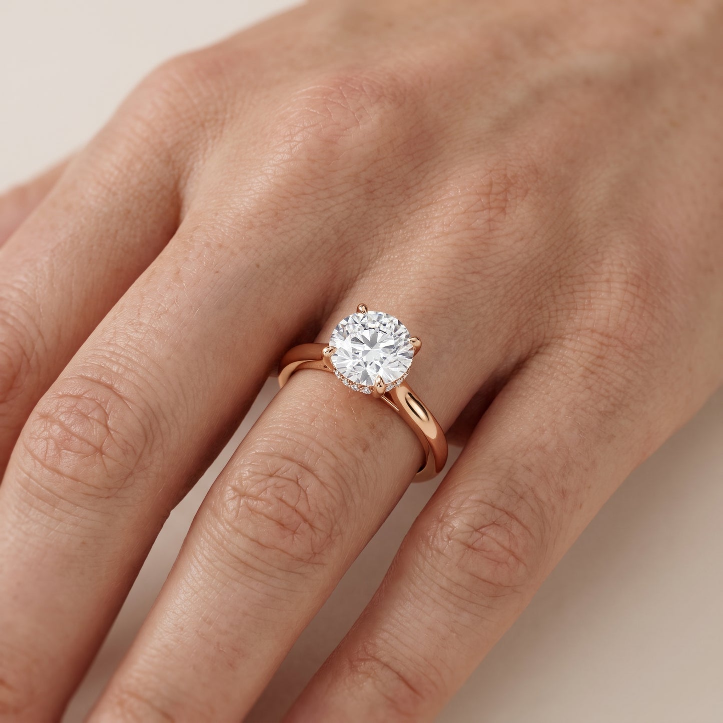 Mena Hidden Halo Round Diamond Engagement Ring in Rose Gold - lifestyle.jpg