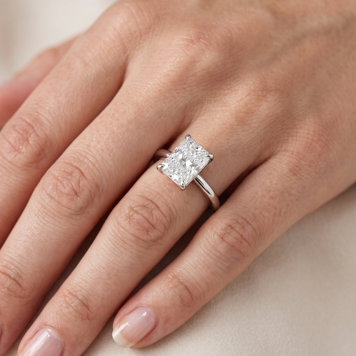 Nella Petite Solitaire Radiant Diamond Engagement Ring in Platinum - lifestyle.jpg