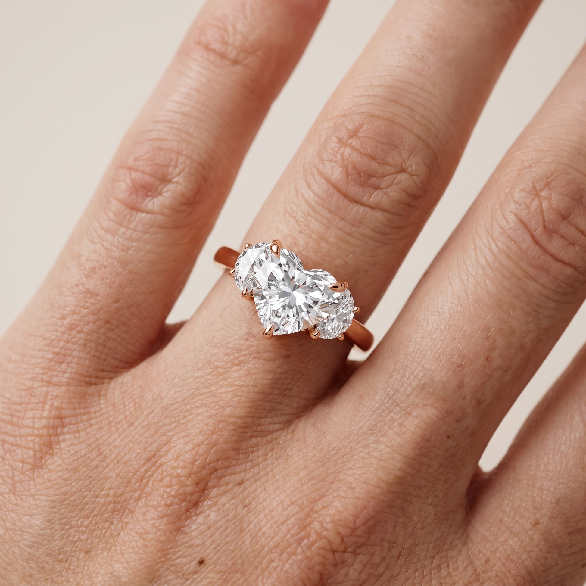 Romy Three-Stone Heart Diamond Engagement Ring in Rose Gold - lifestyle.jpg