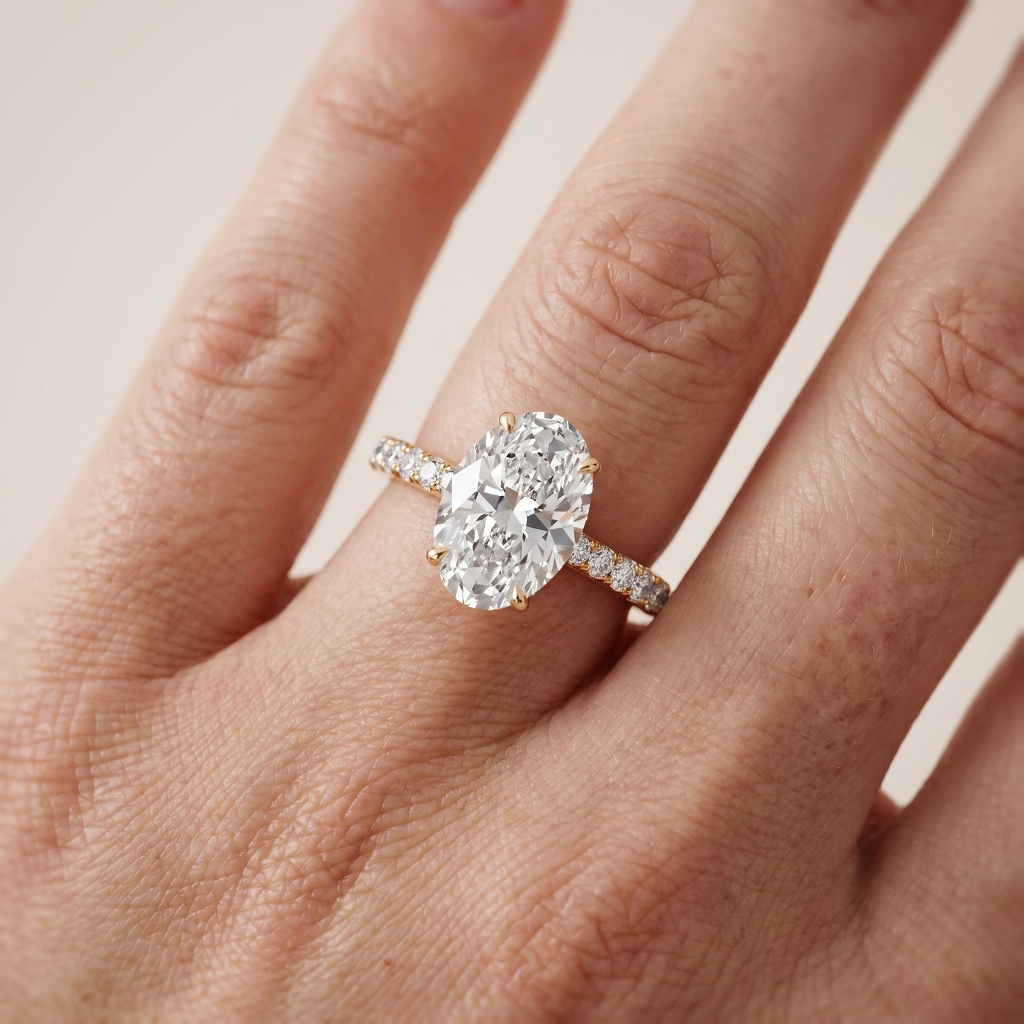 Gia Hidden Halo Pavé Oval Diamond Ring in Yellow Gold - lifestyle.jpg