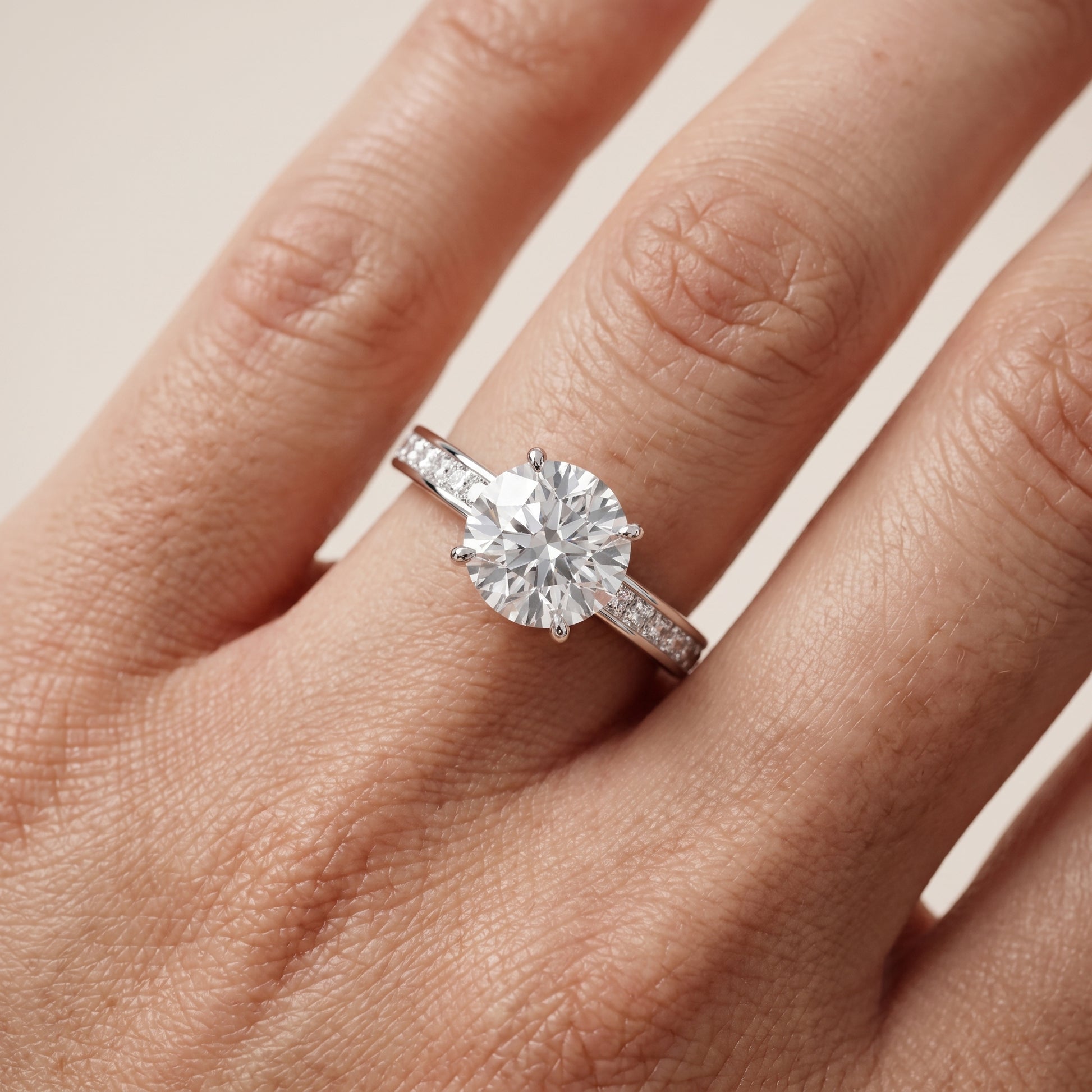 Brielle Channel Set Solitaire Round Diamond Ring in Platinum - lifestyle.jpg