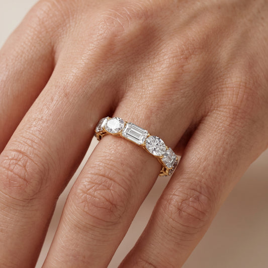 Hema Shared Prong Emerald & Oval Diamond Eternity Band in Yellow Gold - lifestyle.jpg