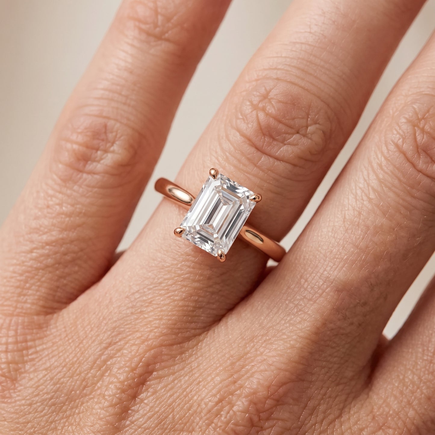 Kalia Knife Edge Solitaire Emerald Diamond Engagement Ring in Rose Gold - lifestyle.jpg
