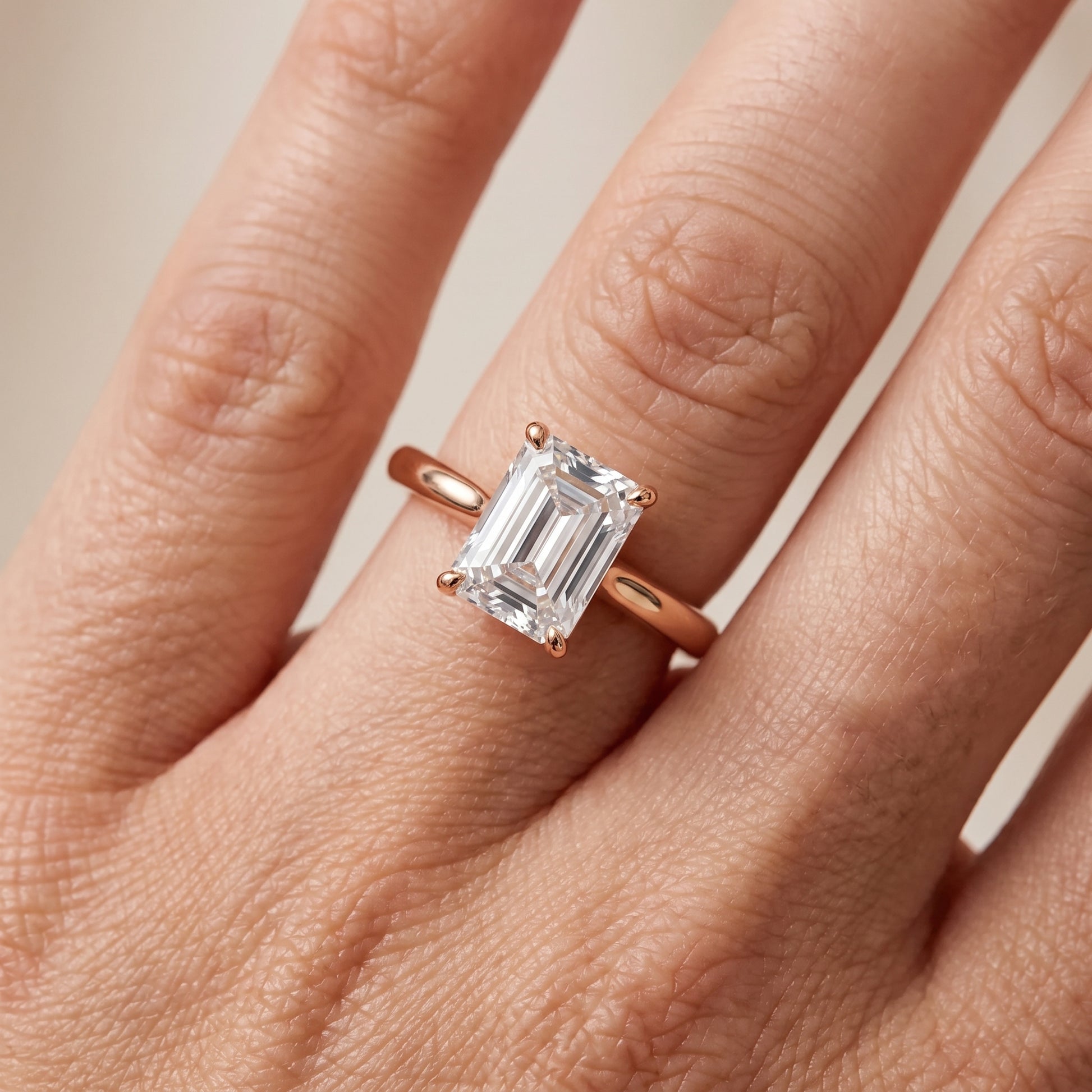 Kalia Knife Edge Solitaire Emerald Diamond Engagement Ring in Rose Gold - lifestyle.jpg