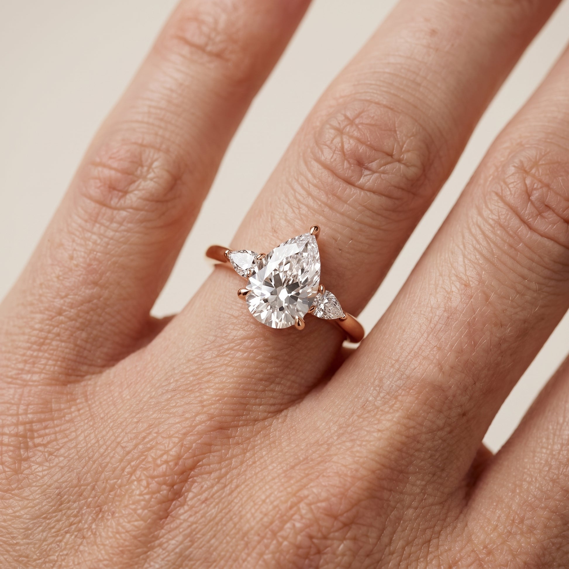 Leila Three-Stone Pear Diamond Engagement Ring in Rose Gold - lifestyle.jpg