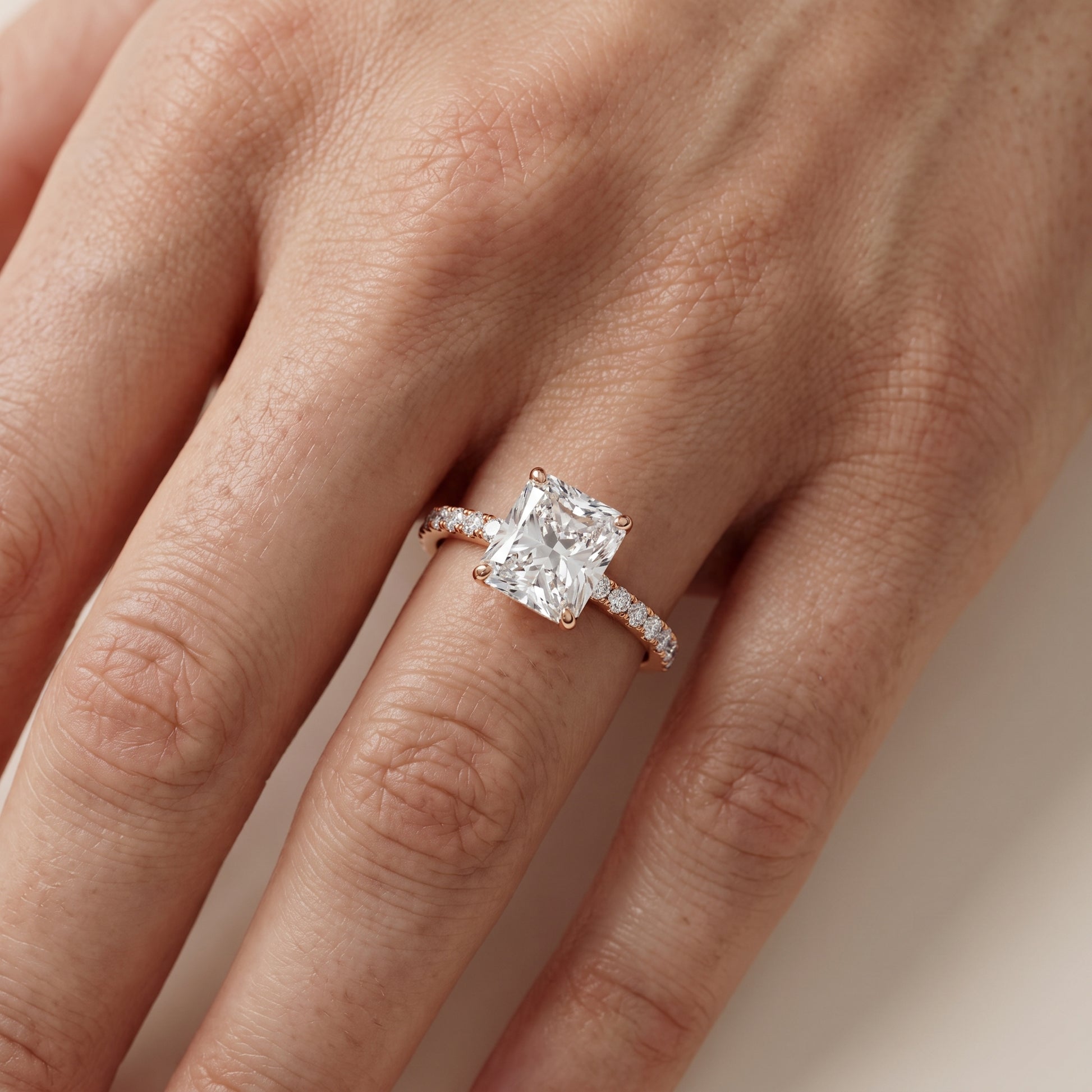 Juna French Pavé Solitaire Radiant Diamond Engagement Ring in Rose Gold - lifestyle.jpg