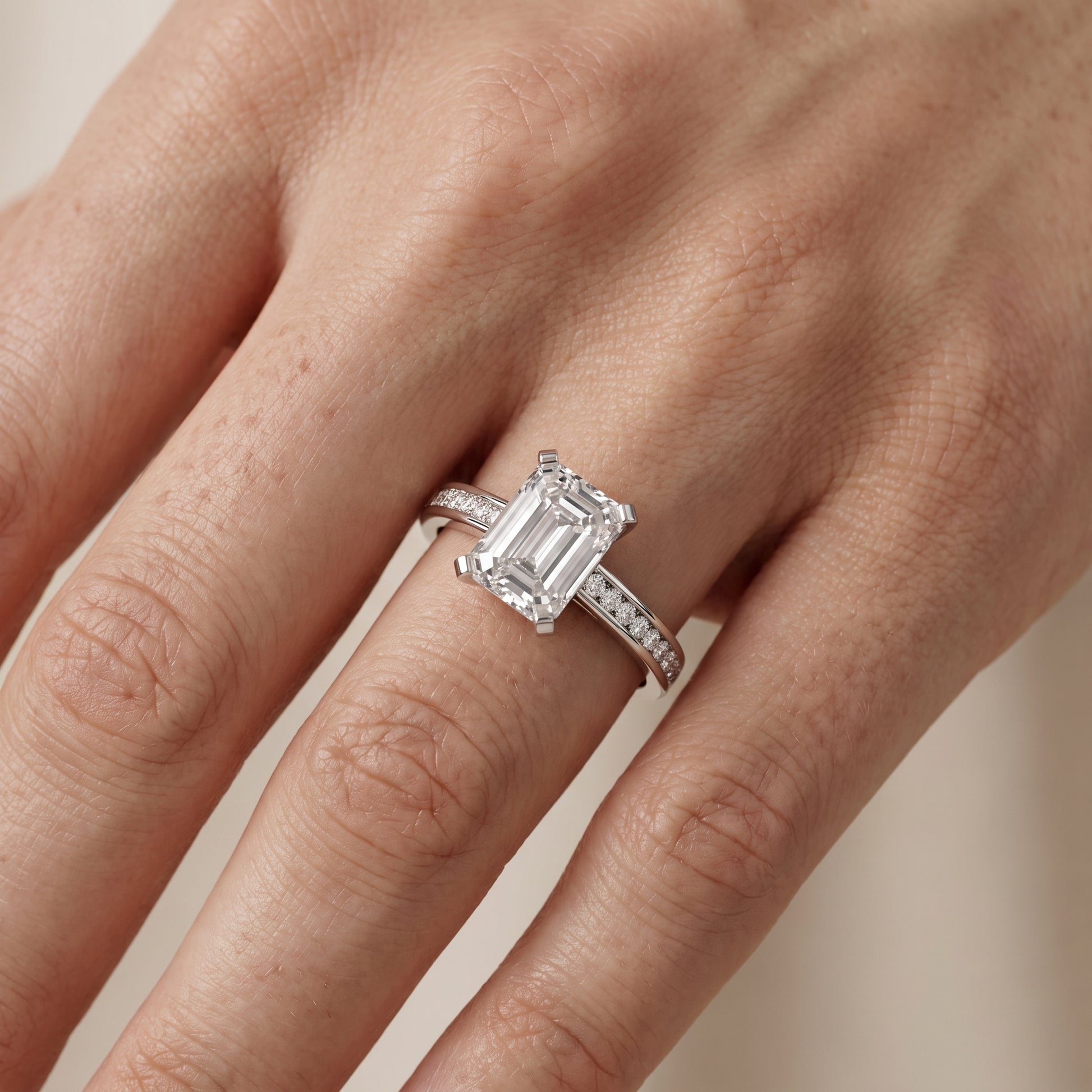 Tessa Solitaire Channel Set Emerald Diamond Engagement Ring in White Gold - lifestyle.jpg