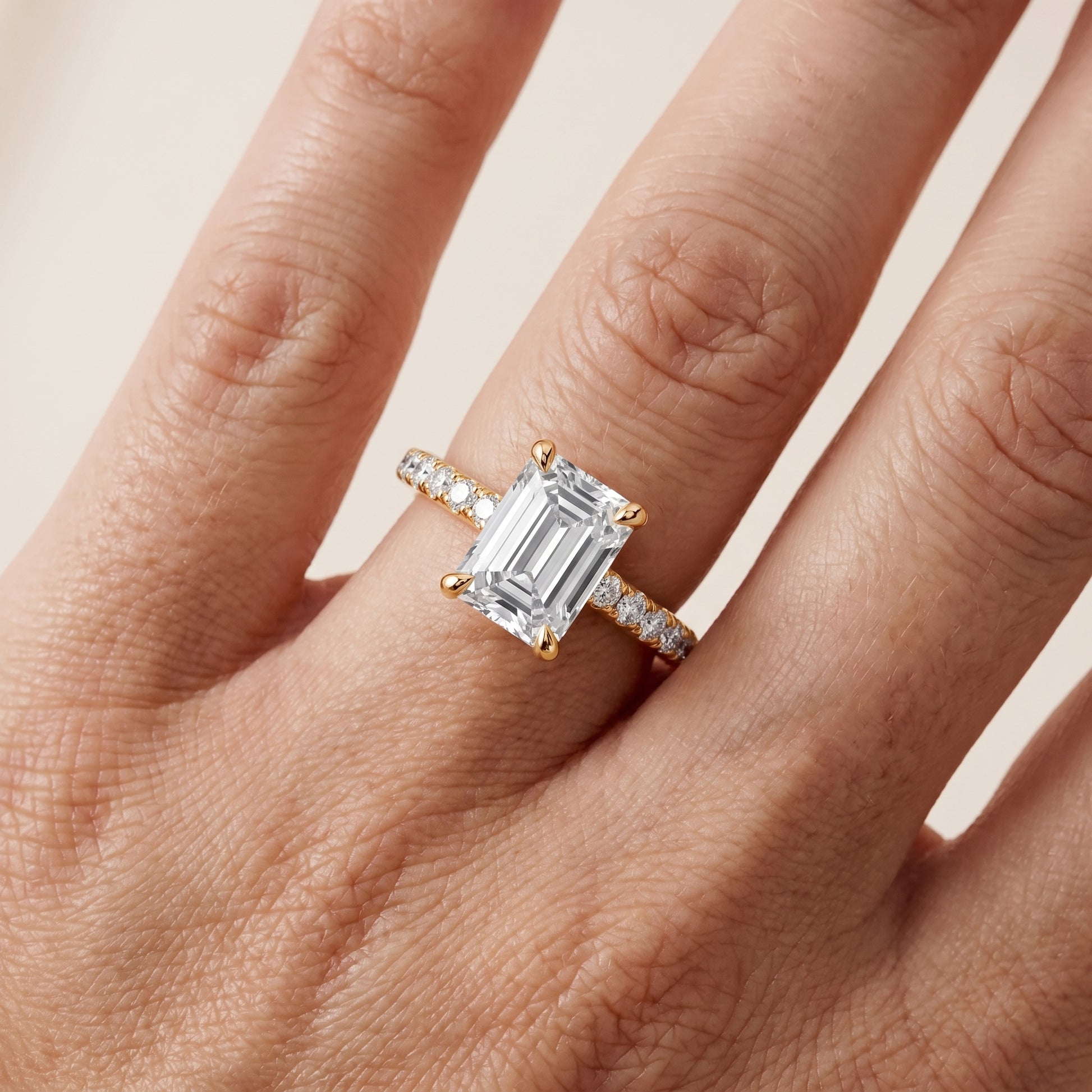 Maya Hidden Halo Pavé Emerald Diamond Engagement Ring in Yellow Gold - lifestyle.jpg