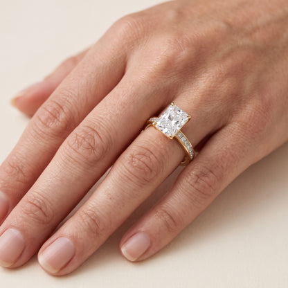 Brielle Channel Set Solitaire Radiant Diamond Engagement Ring in Yellow Gold - lifestyle.jpg