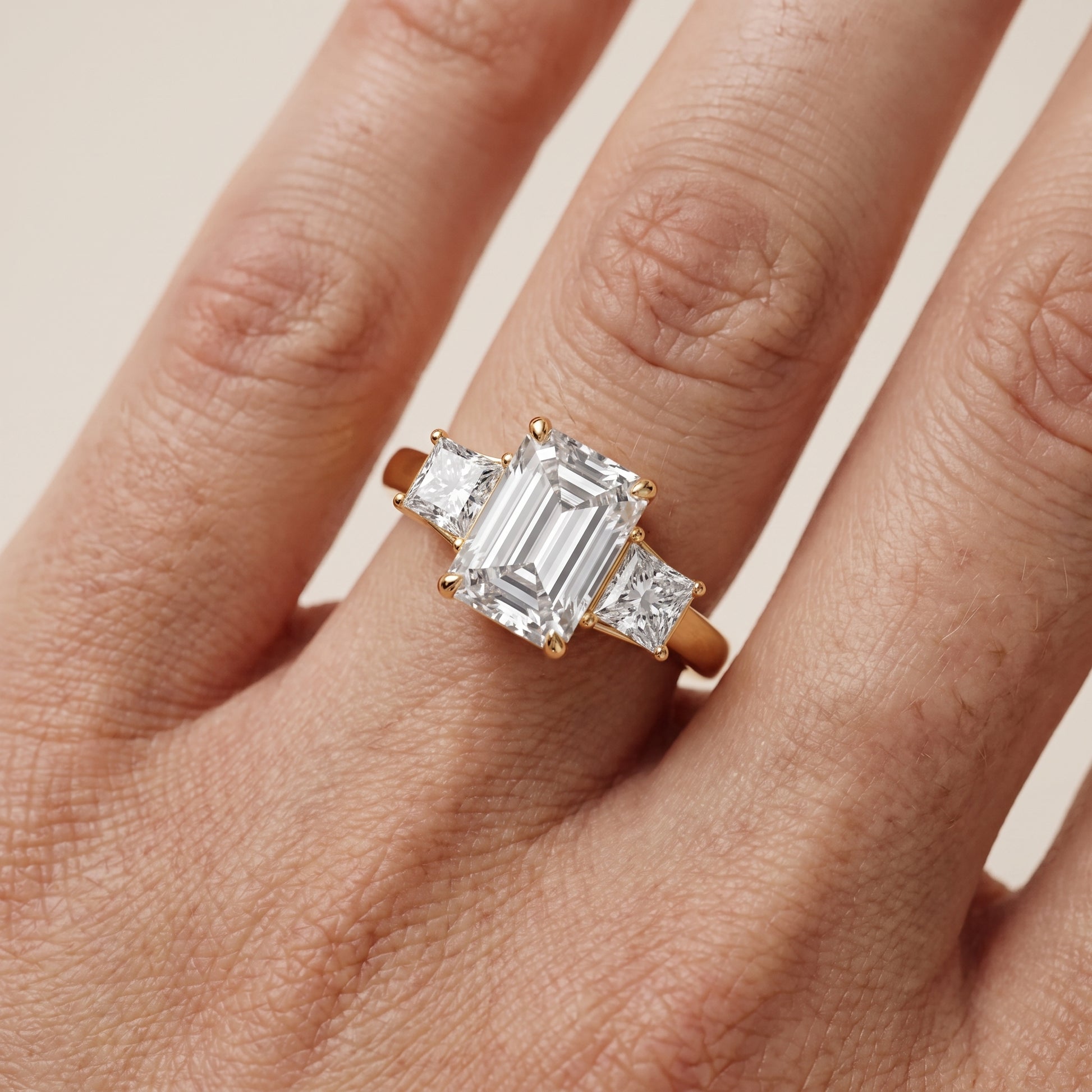 Selena Three-Stone Basket Emerald Diamond Ring in Yellow Gold - lifestyle.jpg