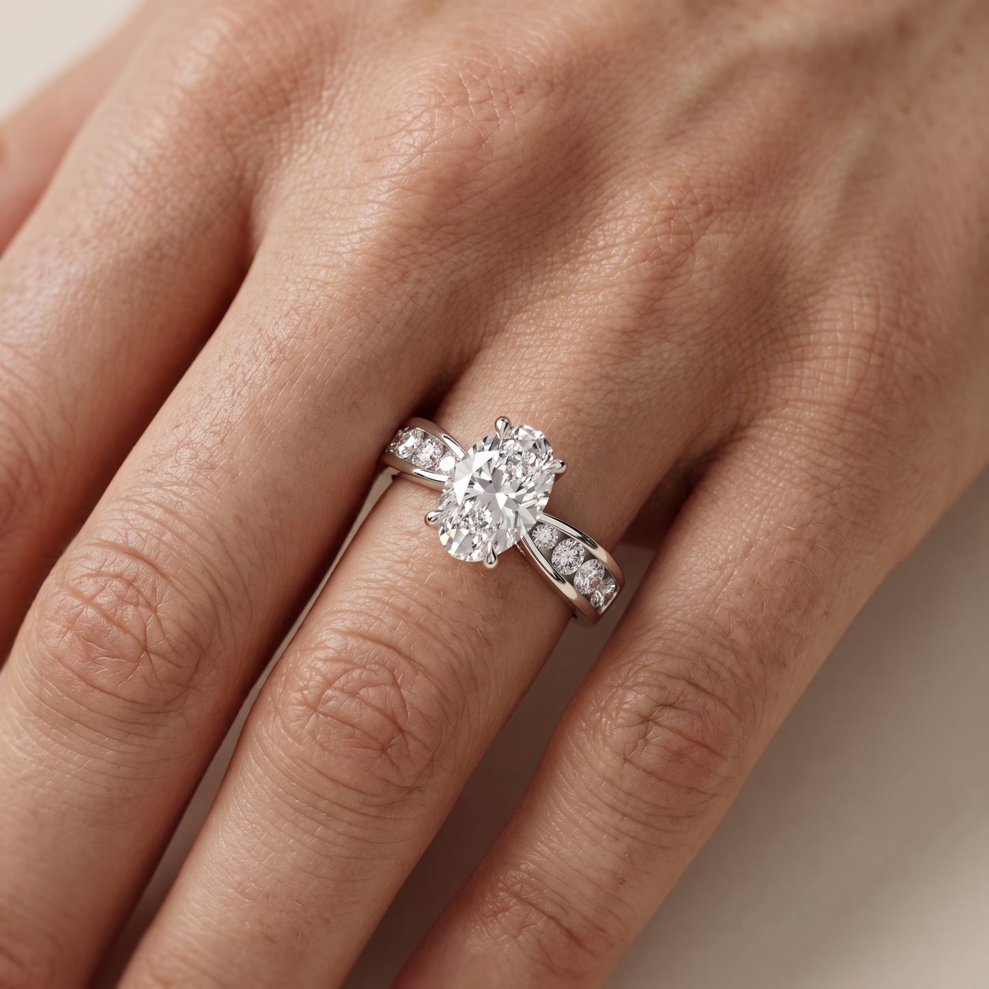 Noor Channel Set Sidestone Oval Diamond Engagement Ring in Platinum - lifestyle.jpg