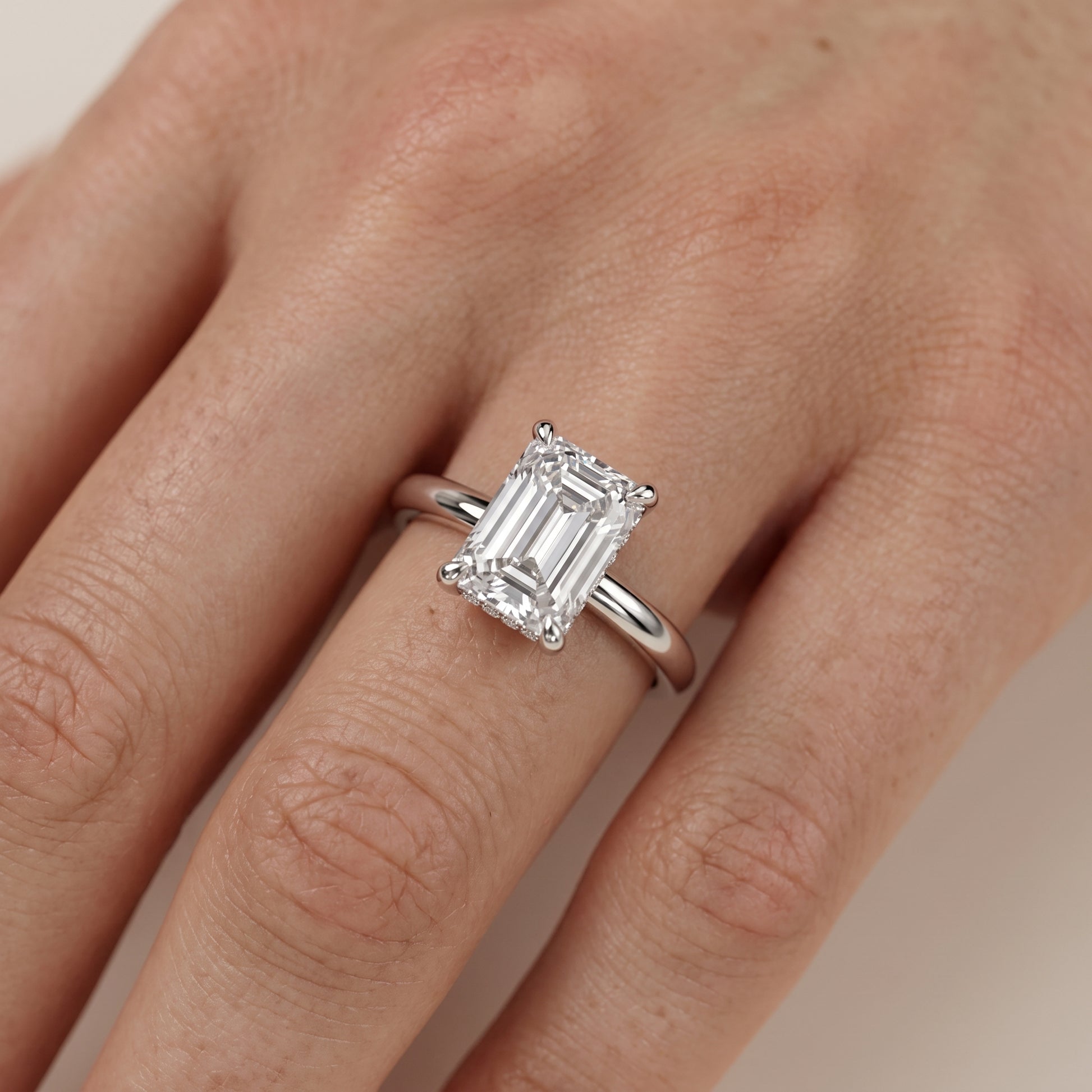 Amaya Hidden Halo Emerald Diamond Ring in Platinum - lifestyle.jpg