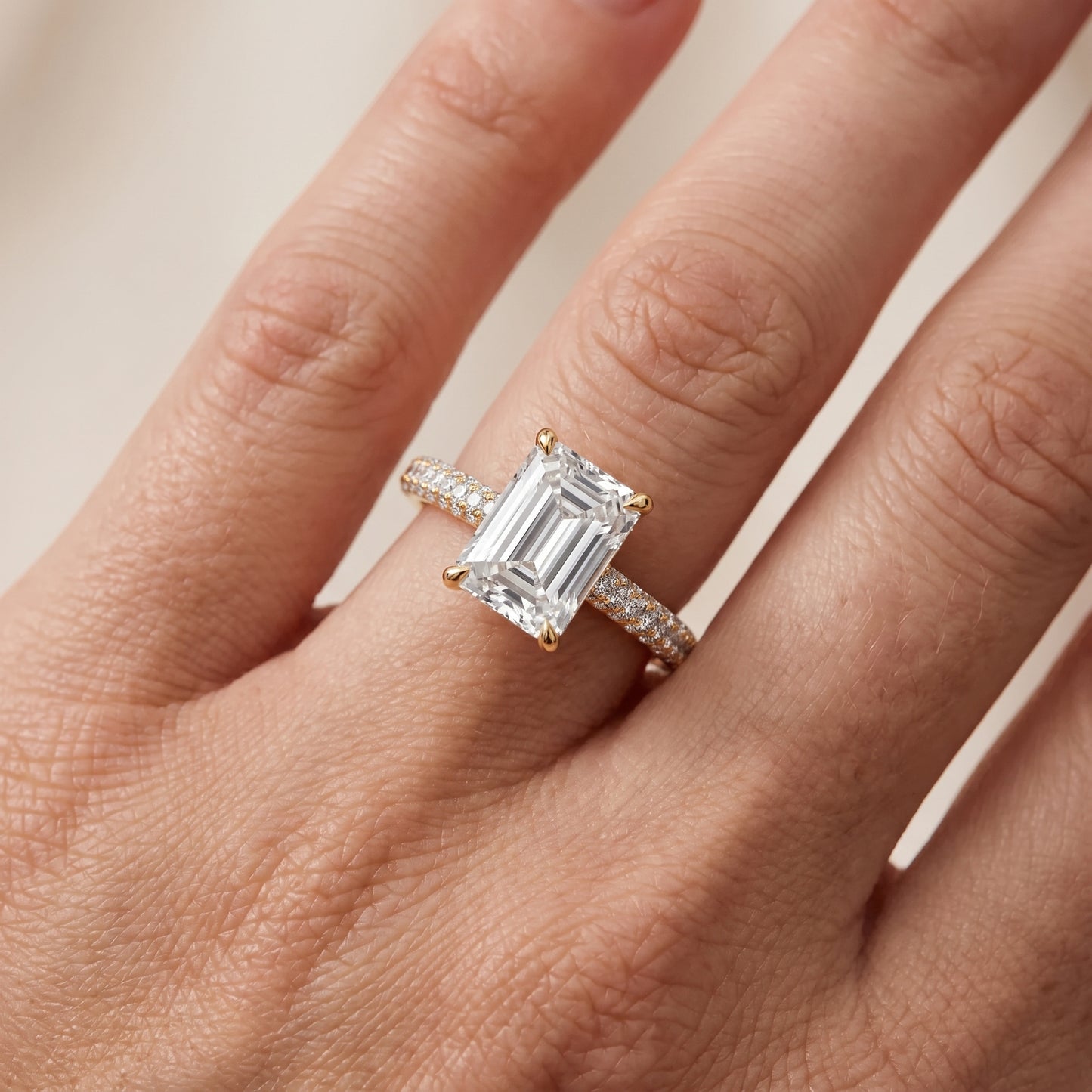 Della Hidden Halo Pavé Emerald Diamond Engagement Ring in Yellow Gold - lifestyle.jpg