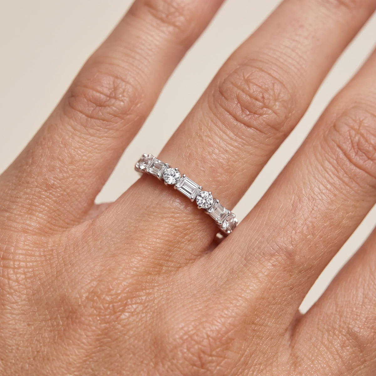Rebecca Four Prong Emerald & Round Diamond Half Eternity Band in Platinum - lifestyle.jpg