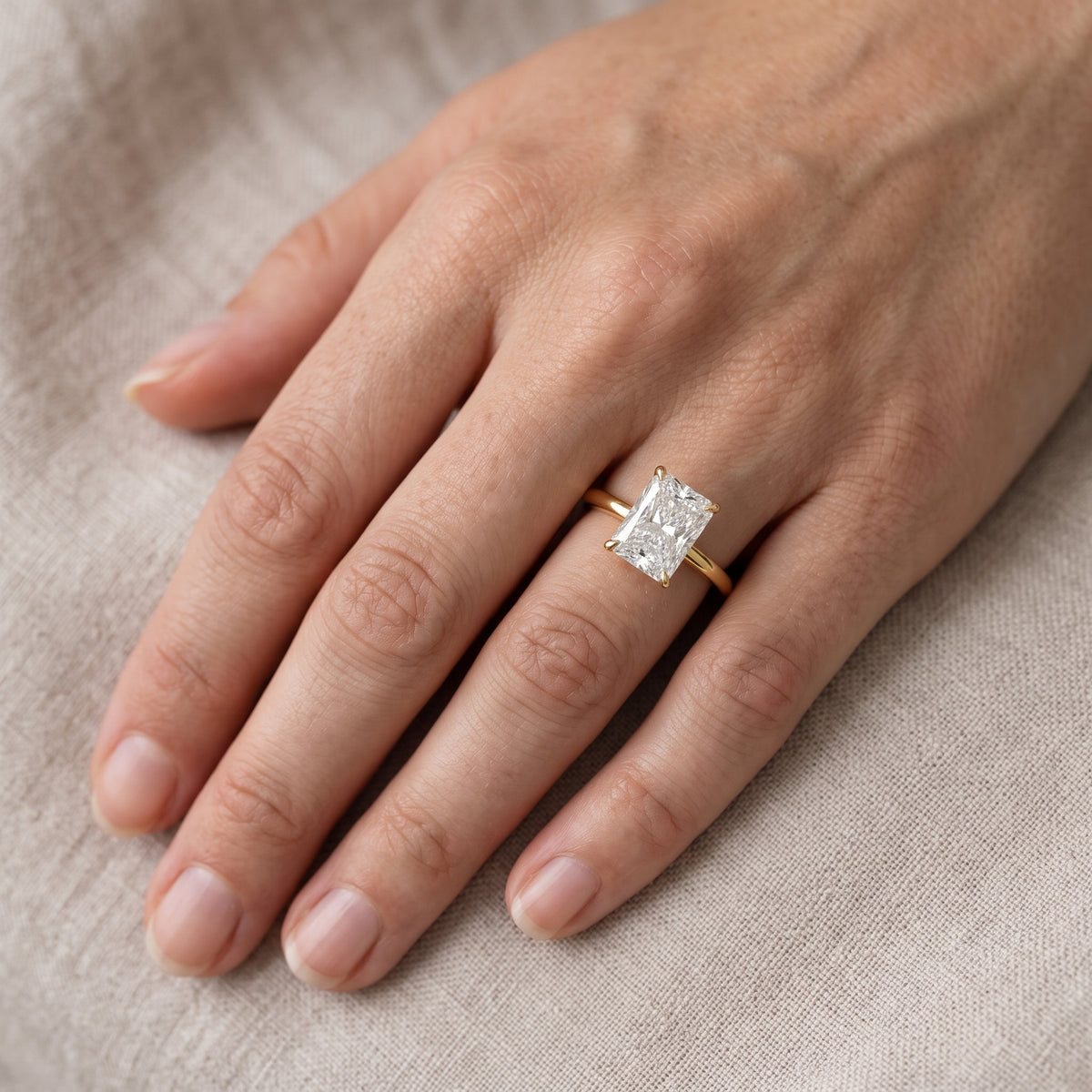 Nadia Petite Solitaire Radiant Diamond Engagement Ring in Yellow Gold - lifestyle.jpg