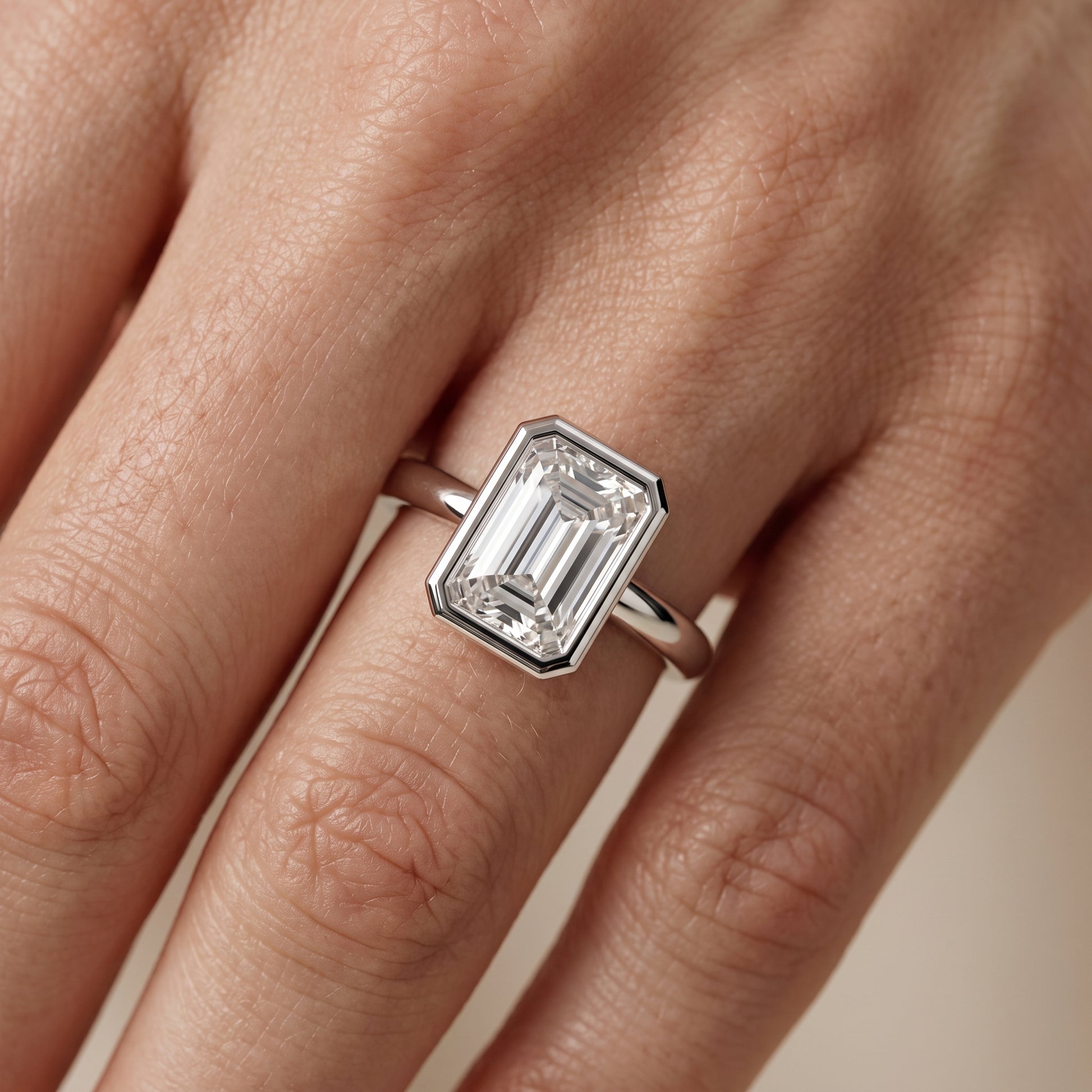 Maeve Bezel Solitaire Emerald Diamond Ring in Platinum - lifestyle.jpg