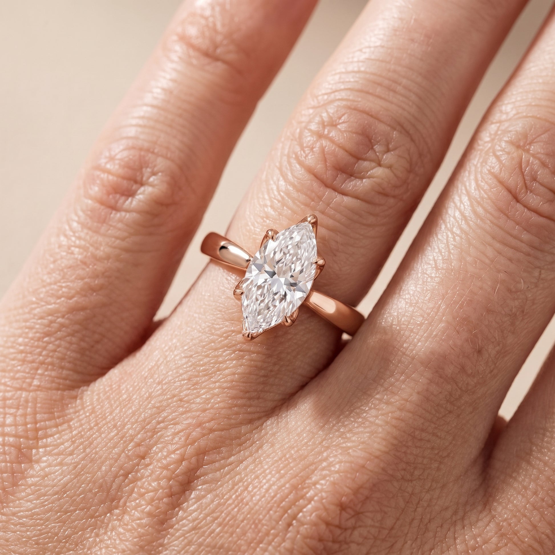 Lucia Solitaire Six-Prong Marquise Diamond Engagement Ring in Rose Gold - lifestyle.jpg