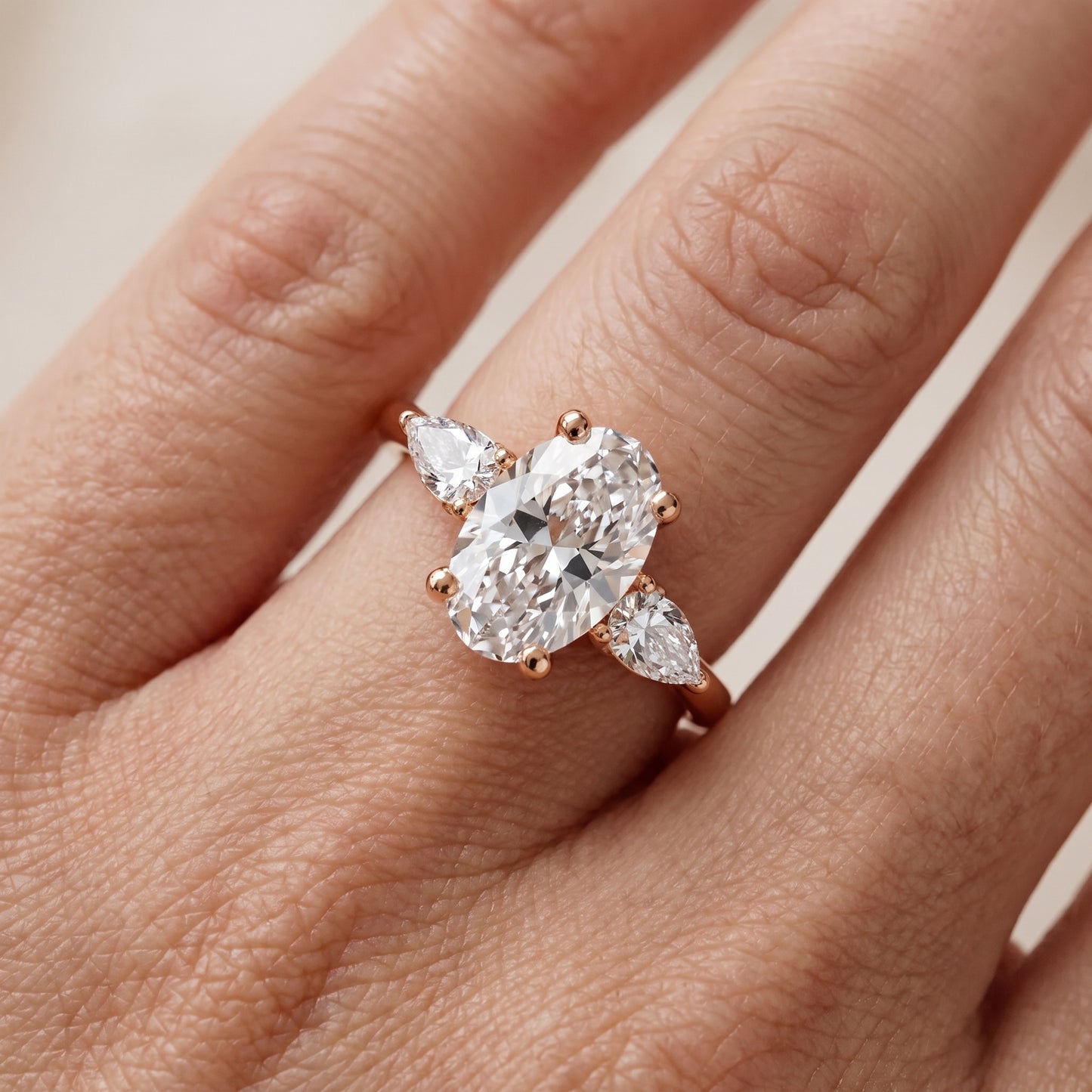 Faye Three-Stone Trellis Oval Diamond Ring in Rose Gold - lifestyle.jpg