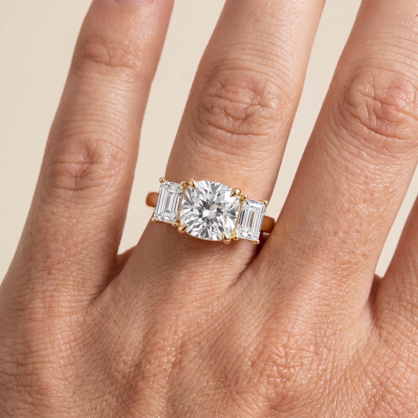 Zoe Three-Stone Cushion Diamond Ring in Yellow Gold - lifestyle.jpg