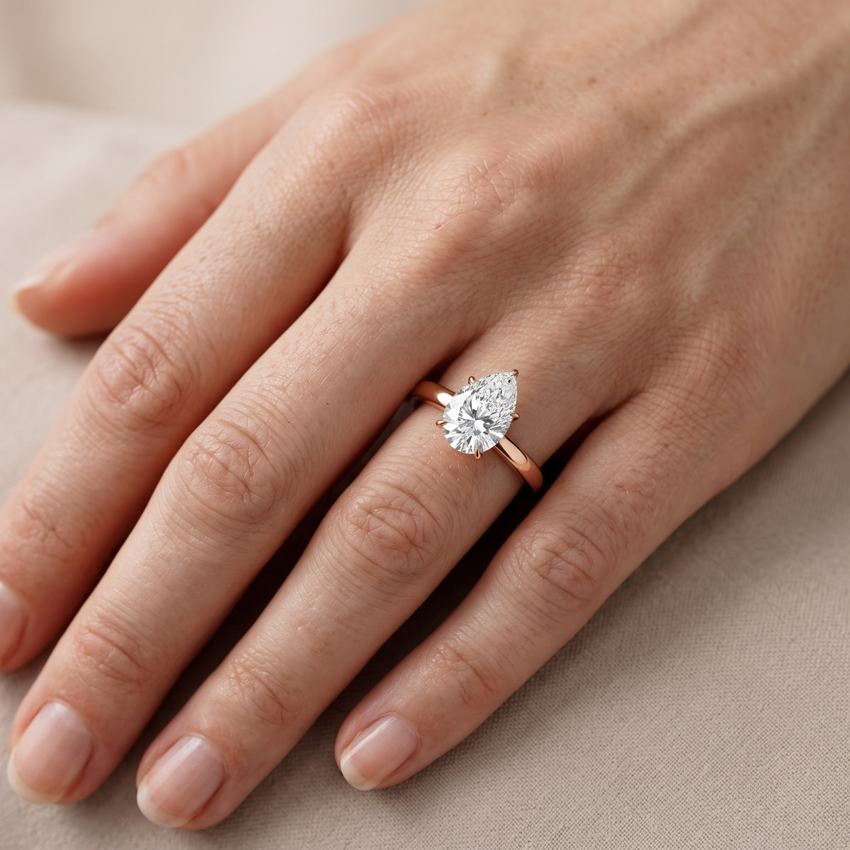 Serena Blossom Solitaire Pear Diamond Engagement Ring in Rose Gold - lifestyle.jpg