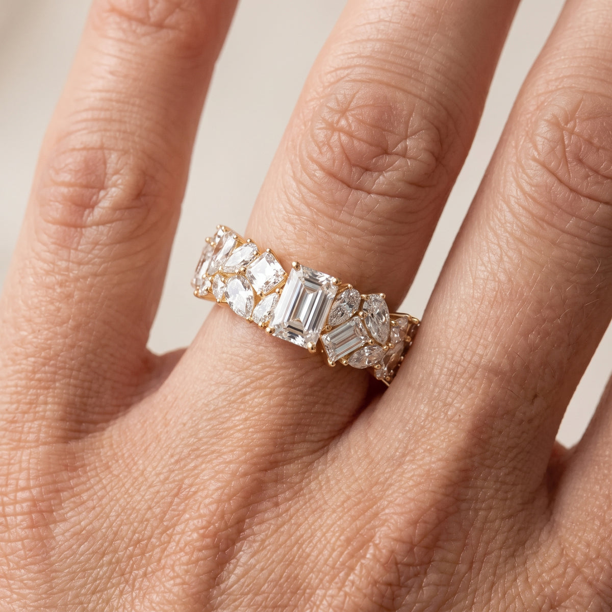 Isha Cluster Emerald & Pear Diamond Anniversary Ring in Yellow Gold - lifestyle.jpg
