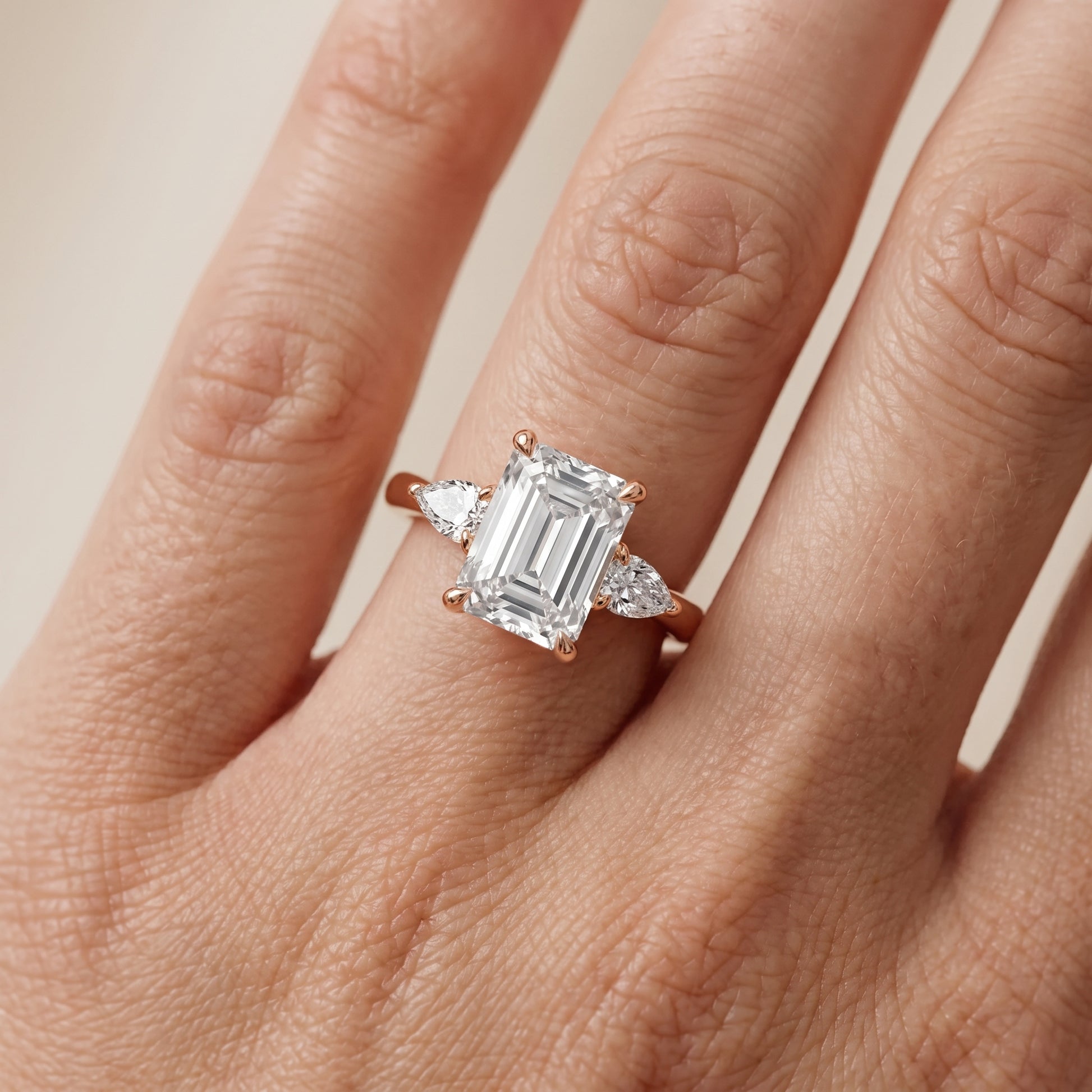 Leila Three-Stone Emerald Diamond Engagement Ring in Rose Gold - lifestyle.jpg