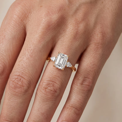 Leila Three-Stone Emerald Diamond Engagement Ring in Yellow Gold - lifestyle.jpg