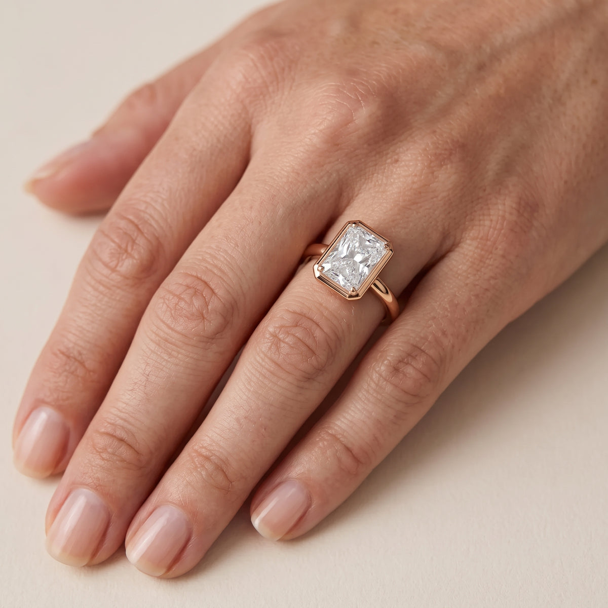 Alina Bezel Solitaire Radiant Diamond Engagement Ring in Rose Gold - lifestyle.jpg