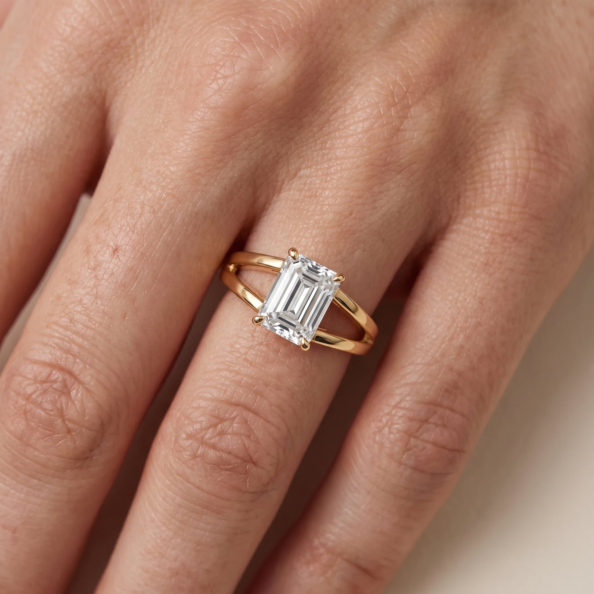 Giselle Solitaire Split Shank Emerald Diamond Engagement Ring in Yellow Gold - lifestyle.jpg