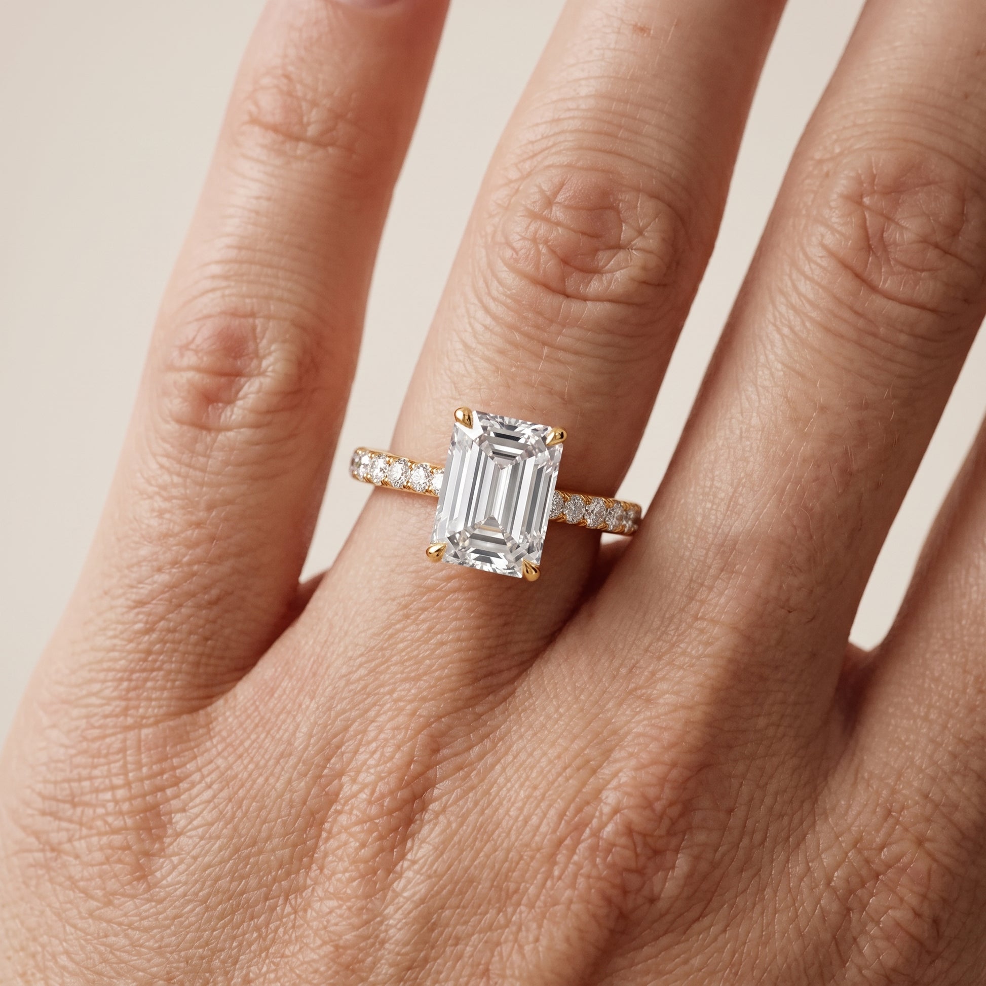 Gia Hidden Halo Pavé Emerald Diamond Ring in Yellow Gold - lifestyle.jpg