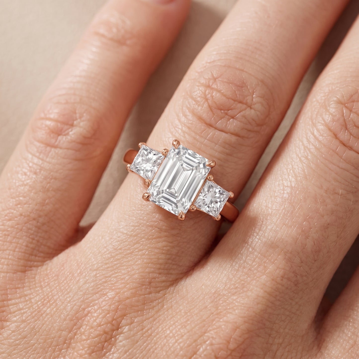 Sienna Three-Stone Emerald Diamond Ring in Rose Gold - lifestyle.jpg