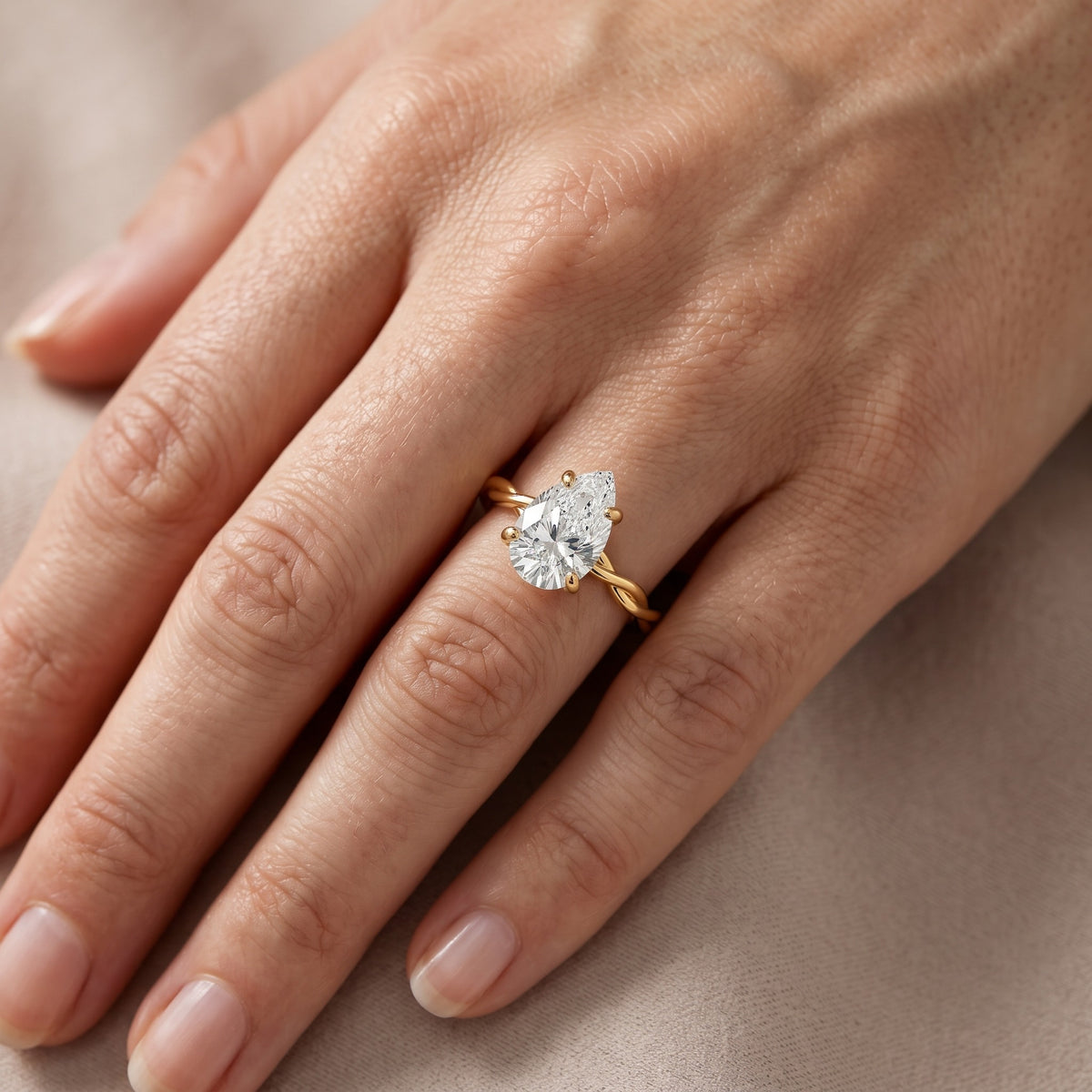 Iris Twist Pear Diamond Engagement Ring in Yellow Gold - lifestyle.jpg