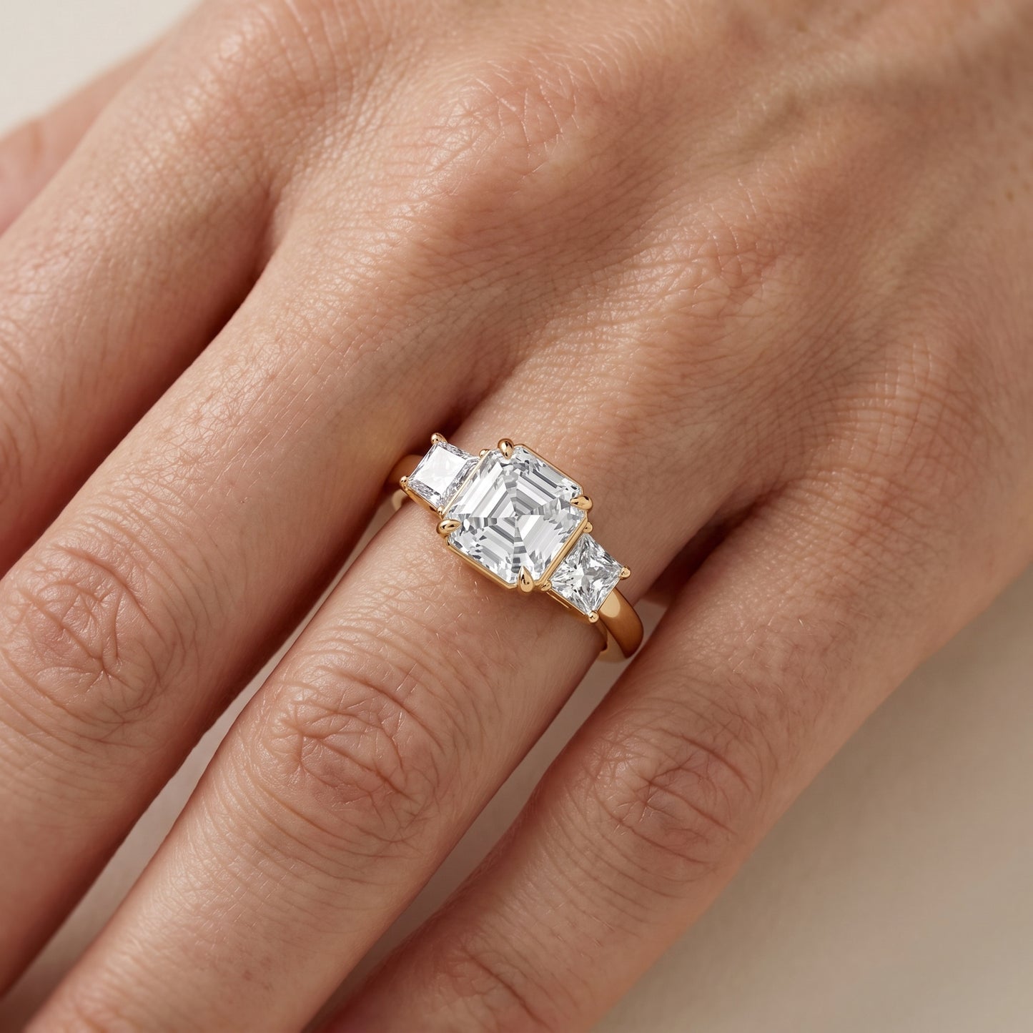 Selena Three-Stone Basket Asscher Diamond Ring in Yellow Gold - lifestyle.jpg