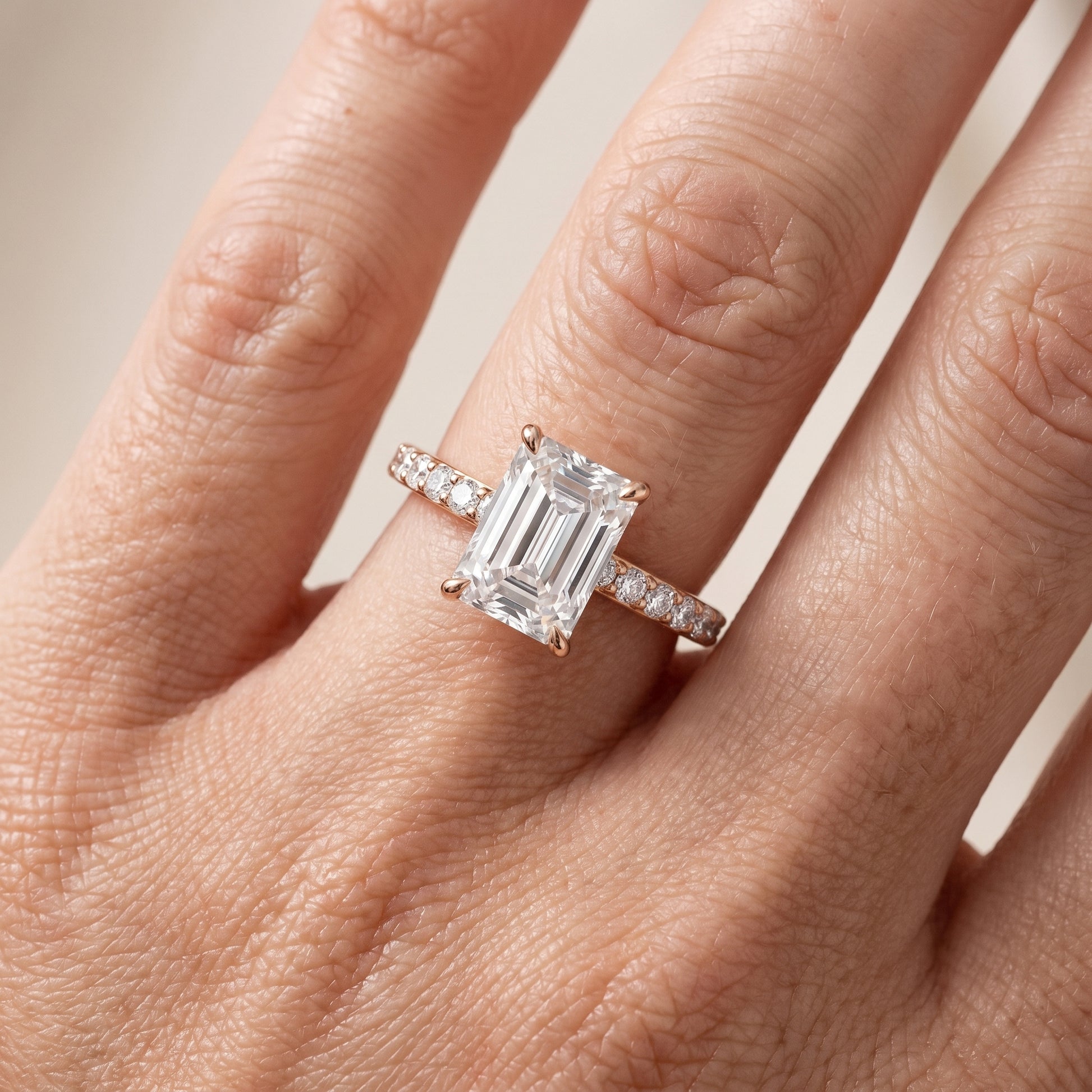 Aisha Pavé Solitaire Emerald Diamond Engagement Ring in Rose Gold - lifestyle.jpg