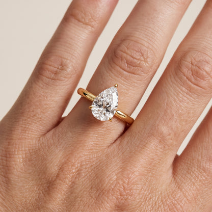 Evie Solitaire Six-Prong Pear Diamond Engagement Ring in Yellow Gold - lifestyle.jpg