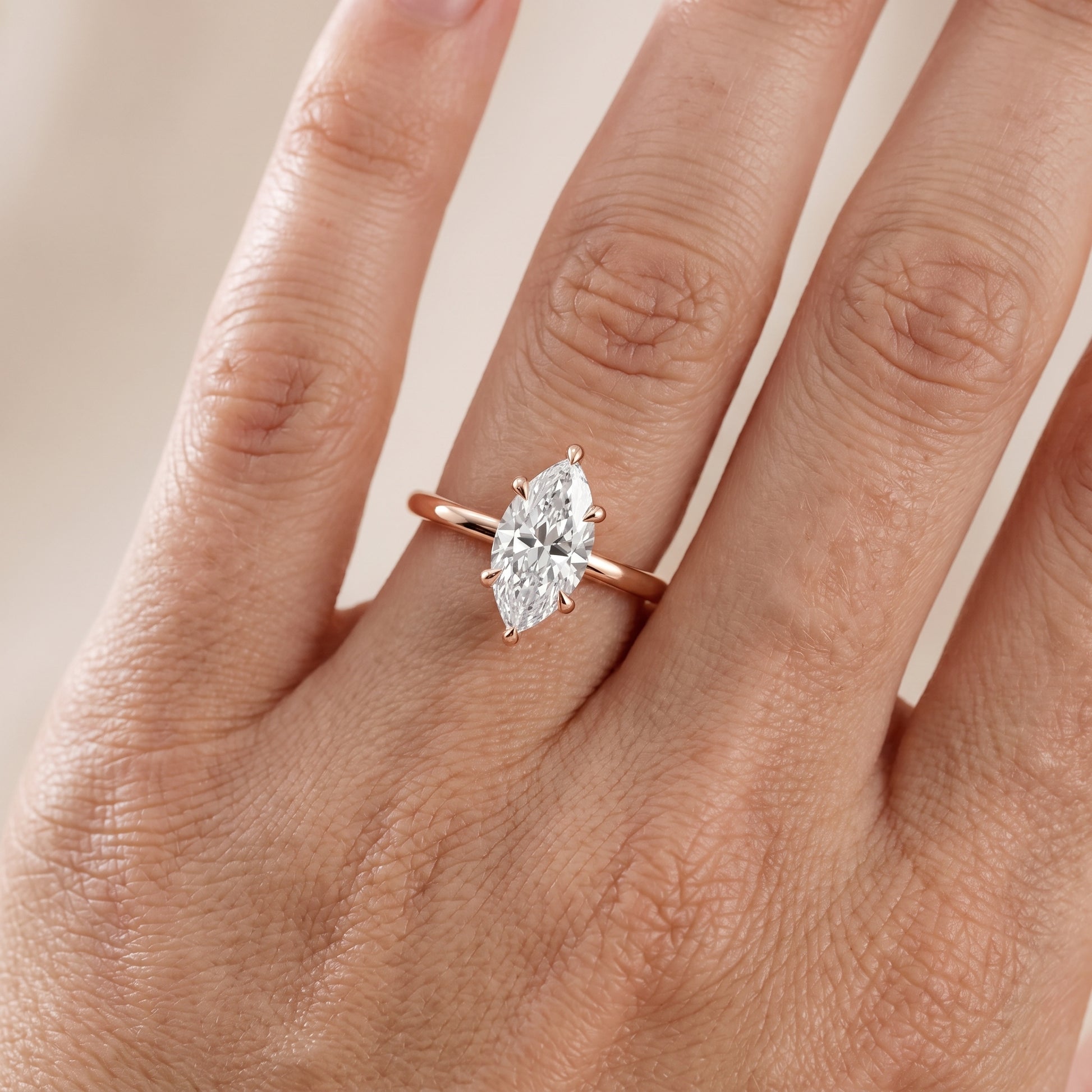 Nella Petite Solitaire Marquise Diamond Engagement Ring in Rose Gold - lifestyle.jpg