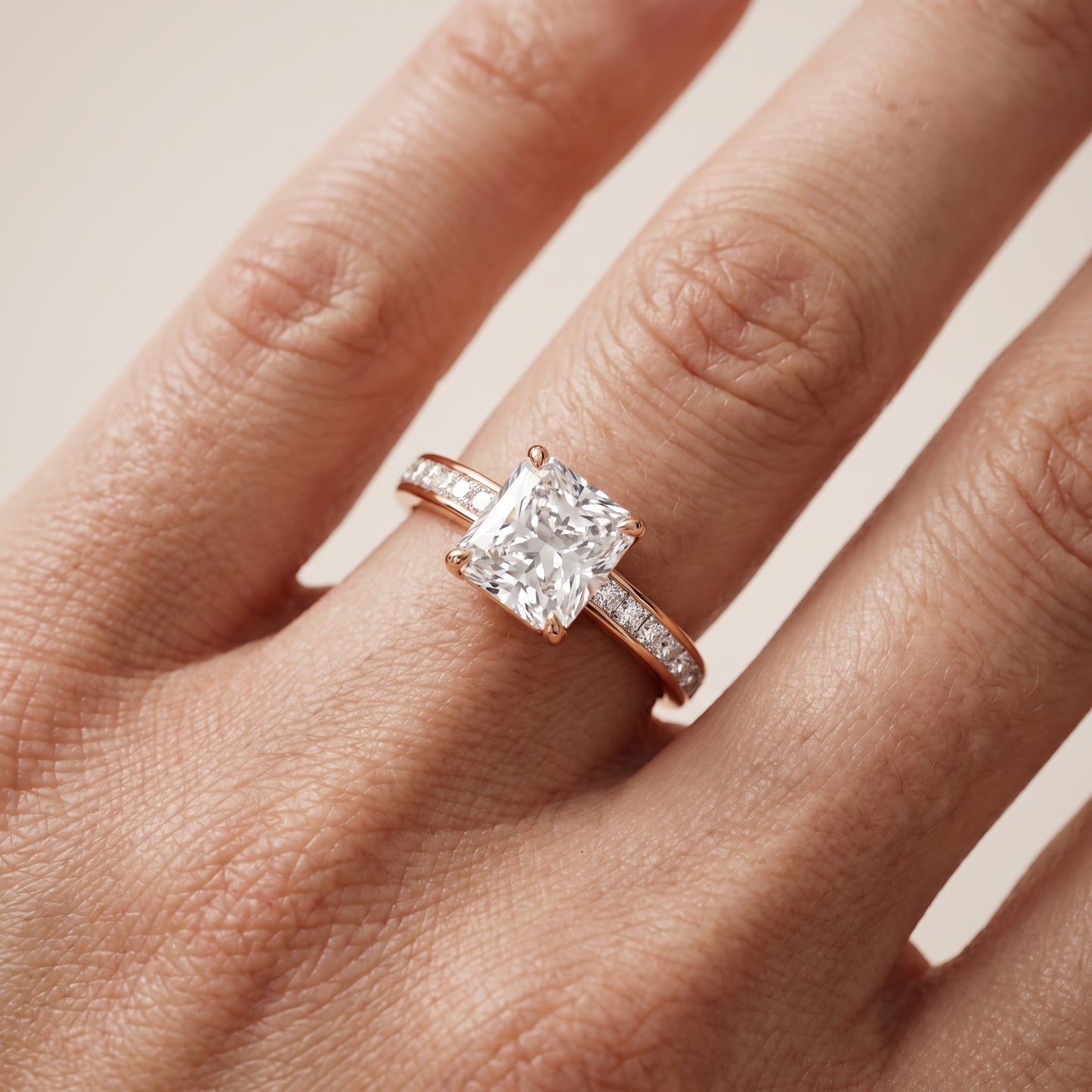 Brielle Channel Set Solitaire Radiant Diamond Ring in Rose Gold - lifestyle.jpg